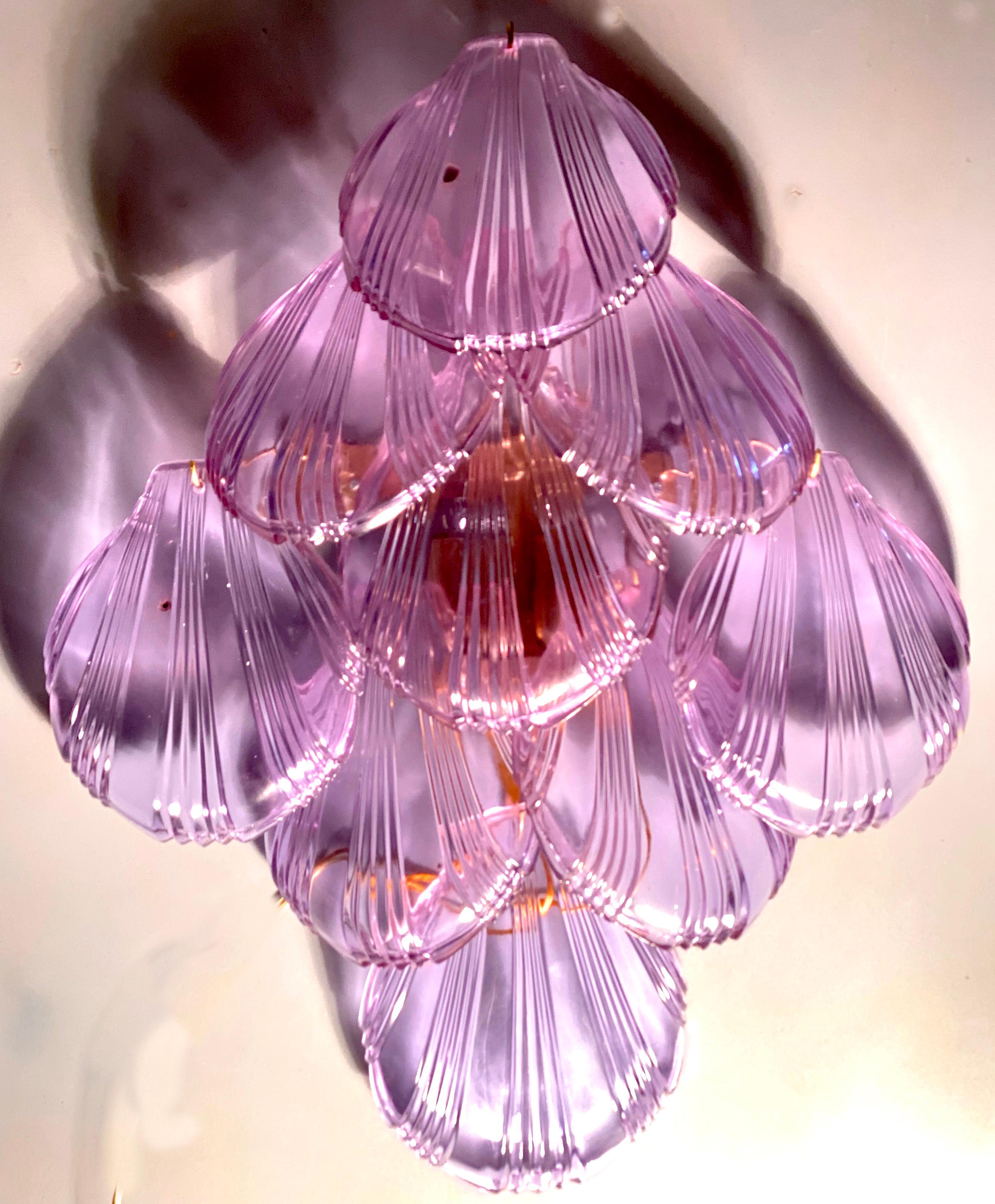 Fabulous Italian Murano glass sconces with a cascade of pink shells giving an extraordinary light effect.
    Available also a matching  chandelier . 
There are 3 E 14 light bulbs
