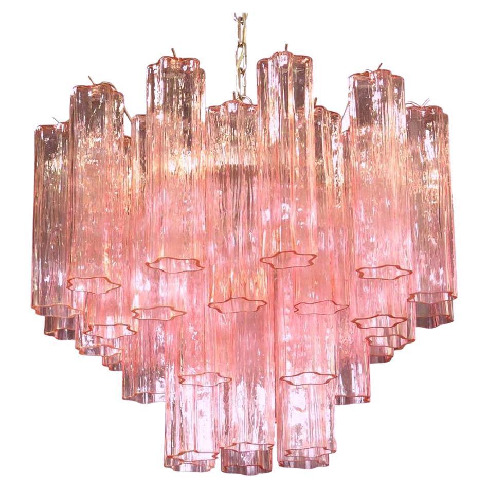 Amazing chandelier includes 36 precious pink tronchi Murano glasses 20 cm long.
Nickel-plated metal structure on three levels.
 Takes 5 base bulbs (E-27) up to 40 watts per bulb.
We can wire the fixture for your country standards. 
 Adjustable