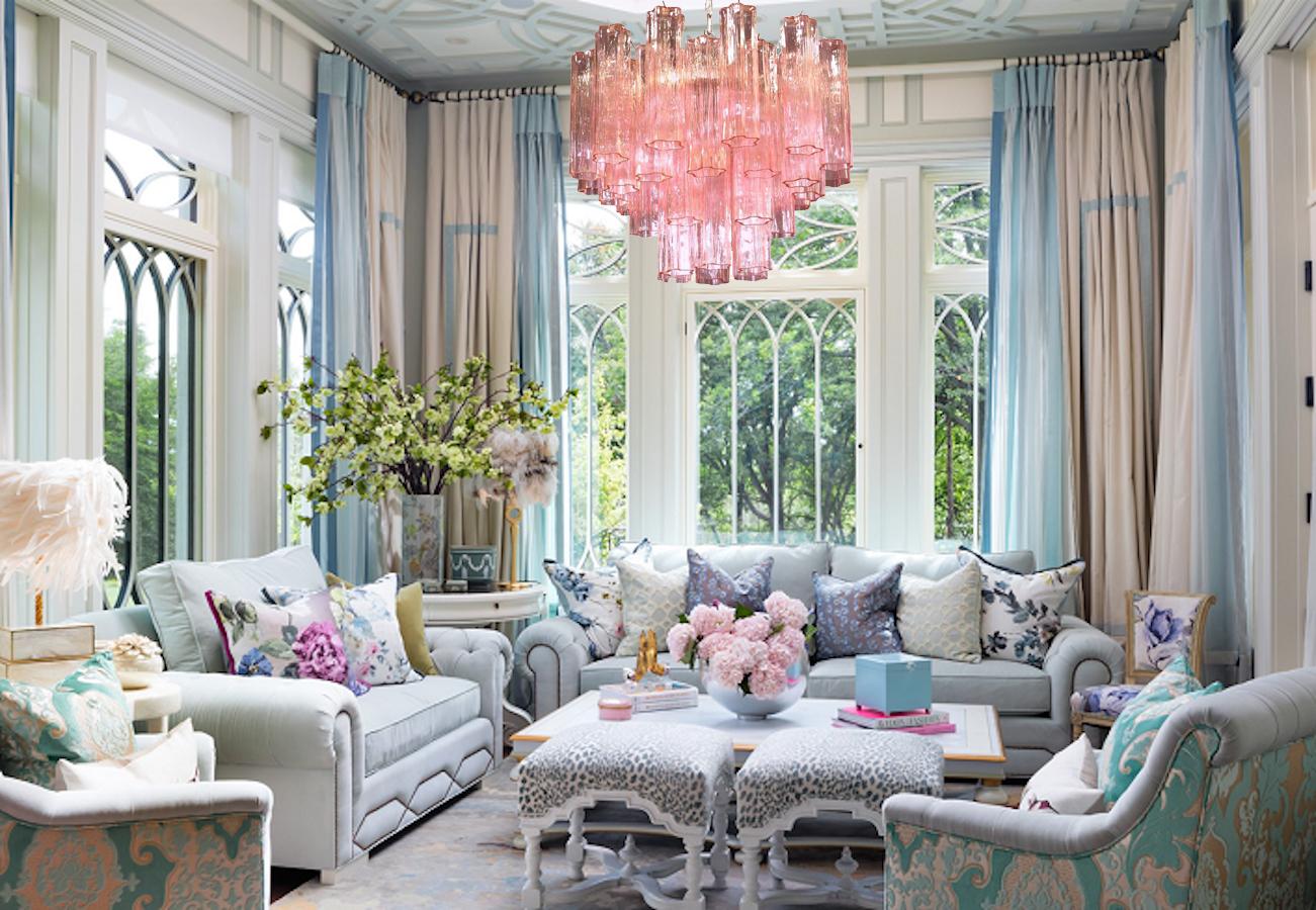 Amazing chandelier includes 36 precious pink tronchi Murano glasses 20 cm long.
Nickel-plated metal structure on three levels.
 Takes 5 base bulbs (E-27) up to 40 watts per bulb.
We can wire the fixture for your country standards. 
 Adjustable