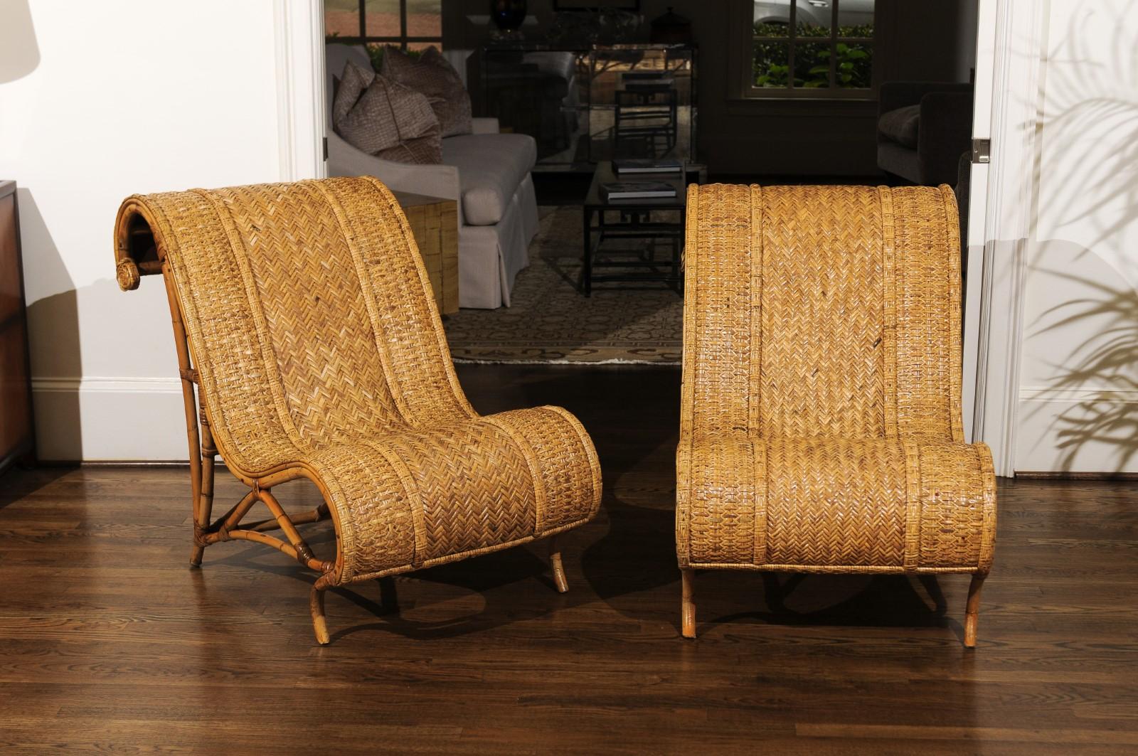 A stunning, highly decorative pair of rattan and raffia slipper chairs with matching ottomans, circa 1980. Stout, comfortable, beautifully conceived rattan frame with fabulous curves and detail veneered in woven cane. Craftsmanship that is beyond