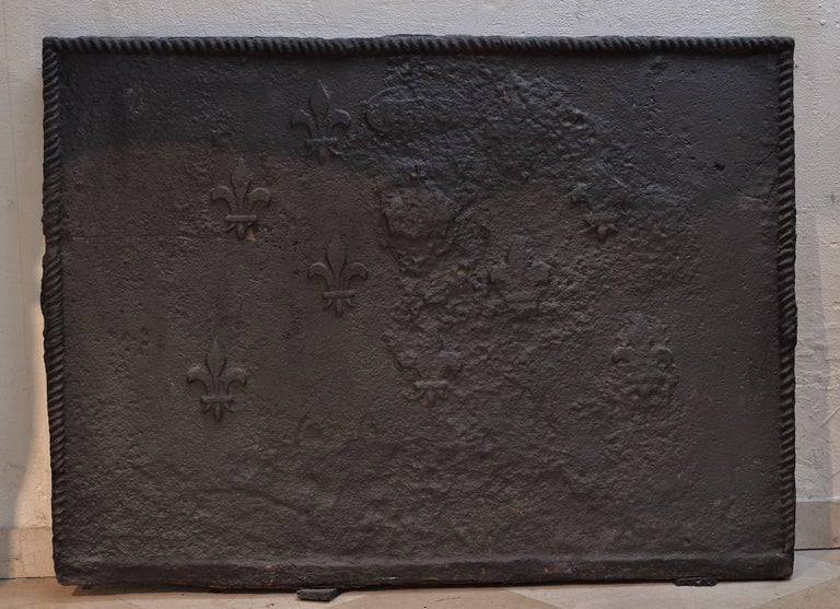 Beautiful rough cast iron antique fireback from the 18th century.
The with rope decorated edges are at some point 2 inch (5 cm) think.
From the original 9 