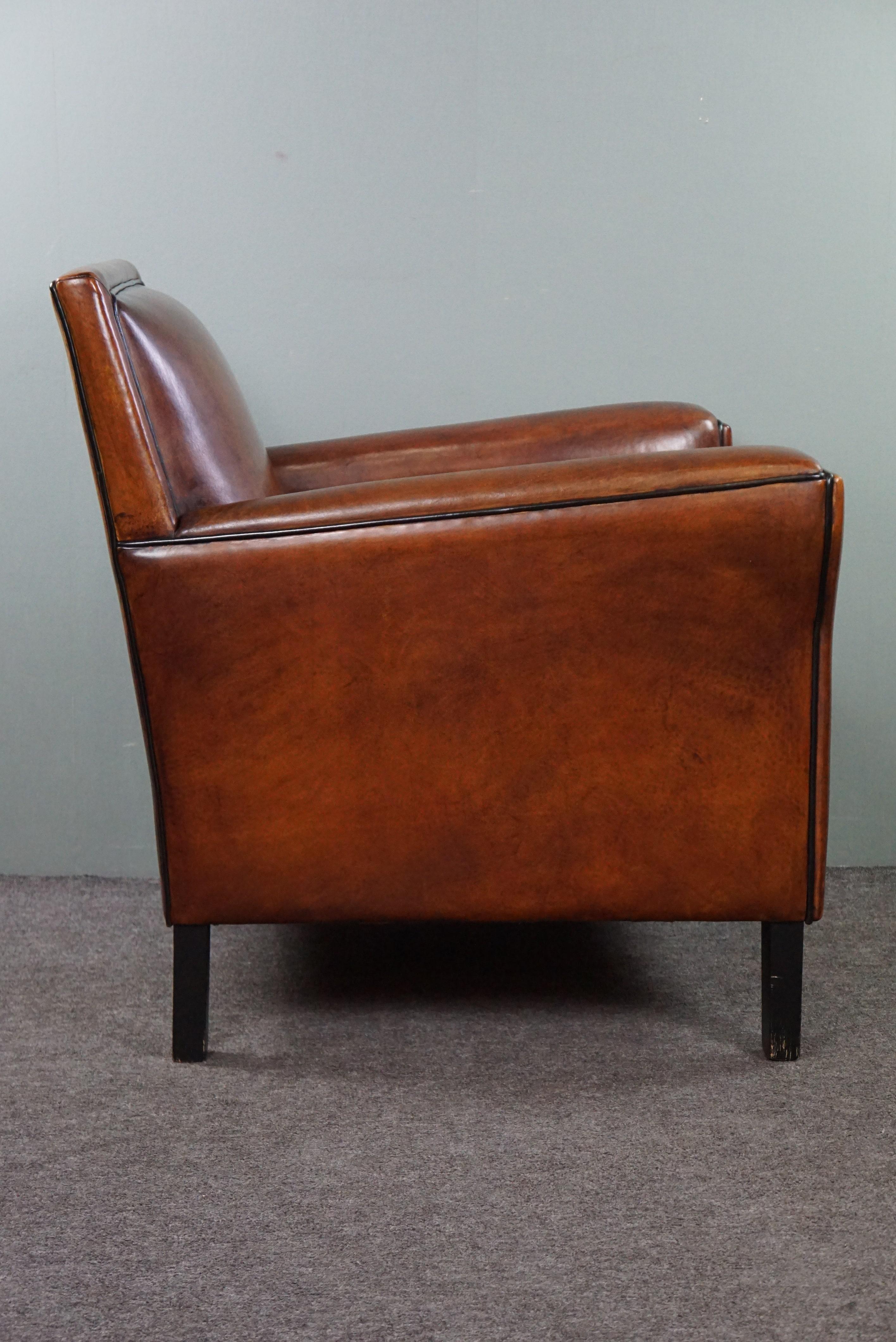 Offered is this high-quality sheep leather armchair with a beautiful hint of Art Deco style. Form, function, comfort, style, and durability – where does one find furniture that bundles all these qualities and showcases them to you in such a