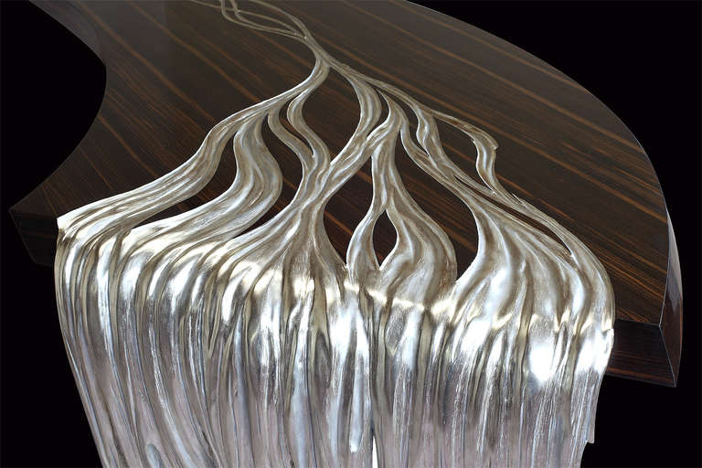 Ebony Macassar. Fold is in silver leaves.
Curved lines and moovmented shapes, very unique piece. High quality craftsmanship,
Will fit in any entrance hall or large living room as a work of art.
Sculptural piece.Has been refinished .
Signed under by