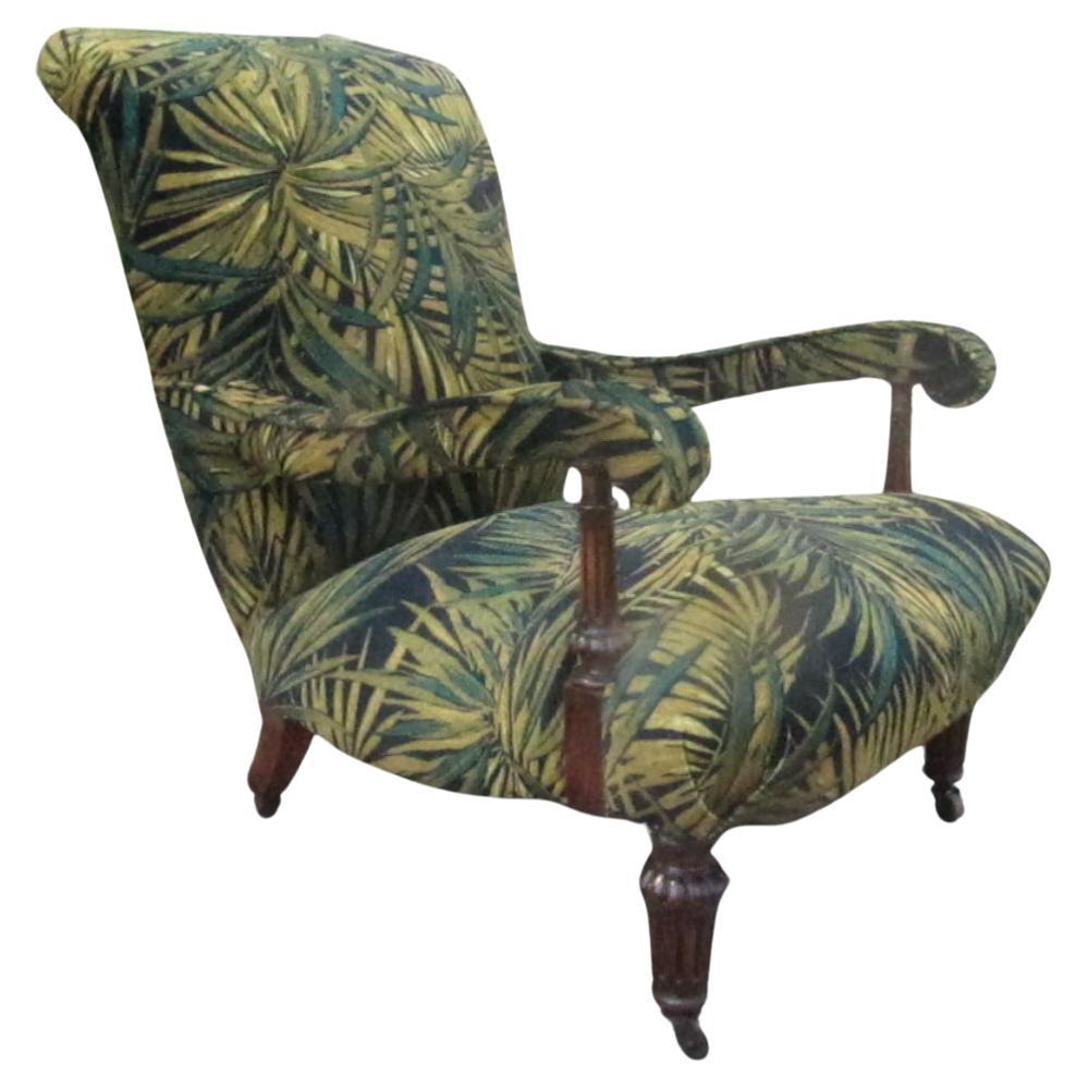 We have brought this chair back to life with a full overhaul, new upholstery,
Linwood butterfly palm print.
Woodwork lovingly  waxed,
1 rear leg historically replaced
Original stamp on other
Original wooden castors