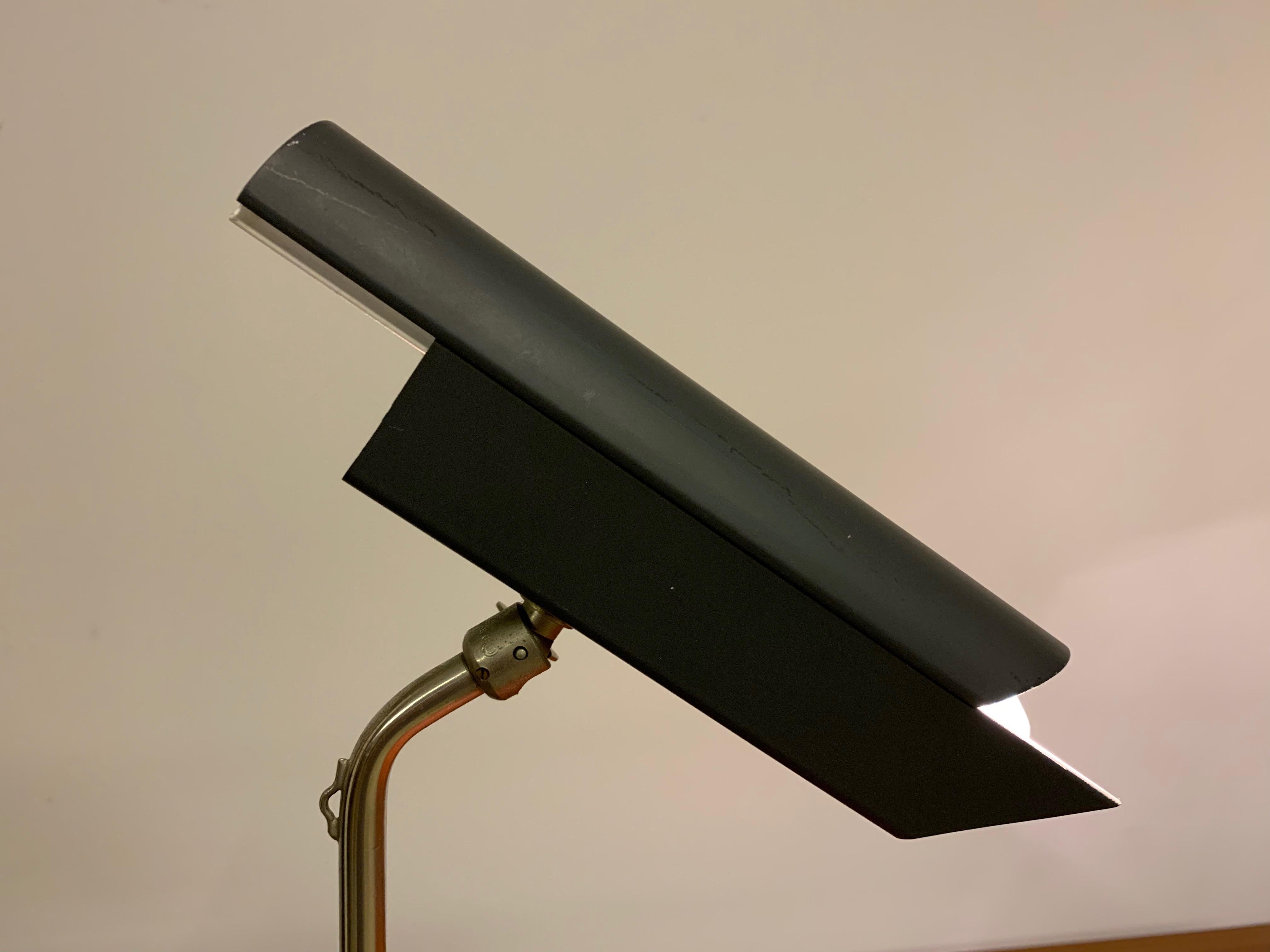 By Bent Karlby for Lyfa. Nickel-plated and black lacquered metal spotlight with grey lacquered metal shade.