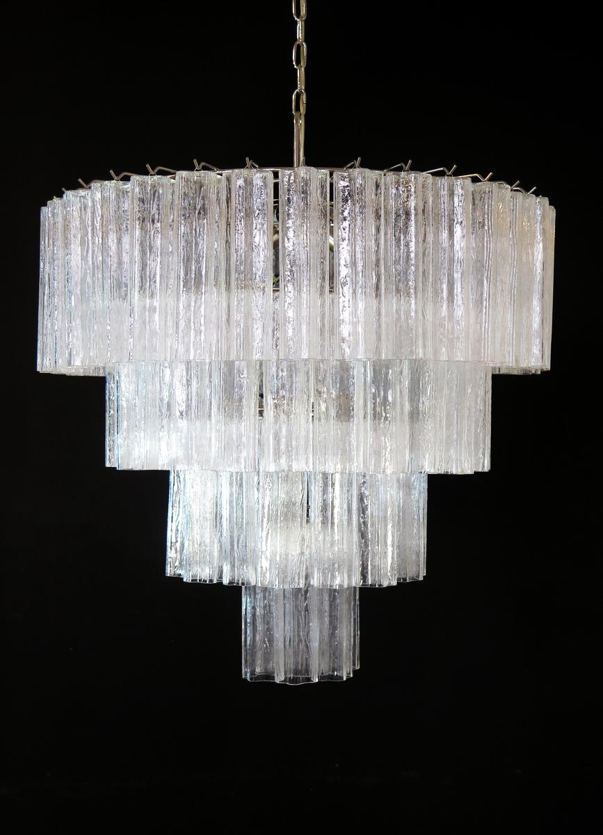 Italian vintage chandelier in Murano glass and nickel plated metal structure on 4 levels. The armor polished nickel supports 78 large amber glass tubes in a star shape.
Period: Late XX century
Dimensions: 63 inches (160 cm) height with chain; 35.45