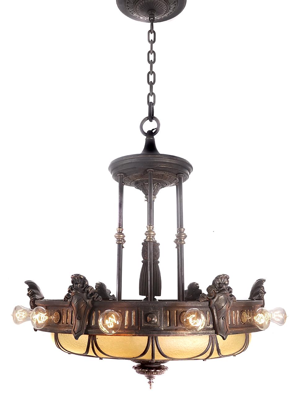 We have a small collection of these leaded glass chandeliers. We were told that they were from a university library on the East Coast. From the socket style I would think that this dates to the turn of the century. They are rich in style and detail.