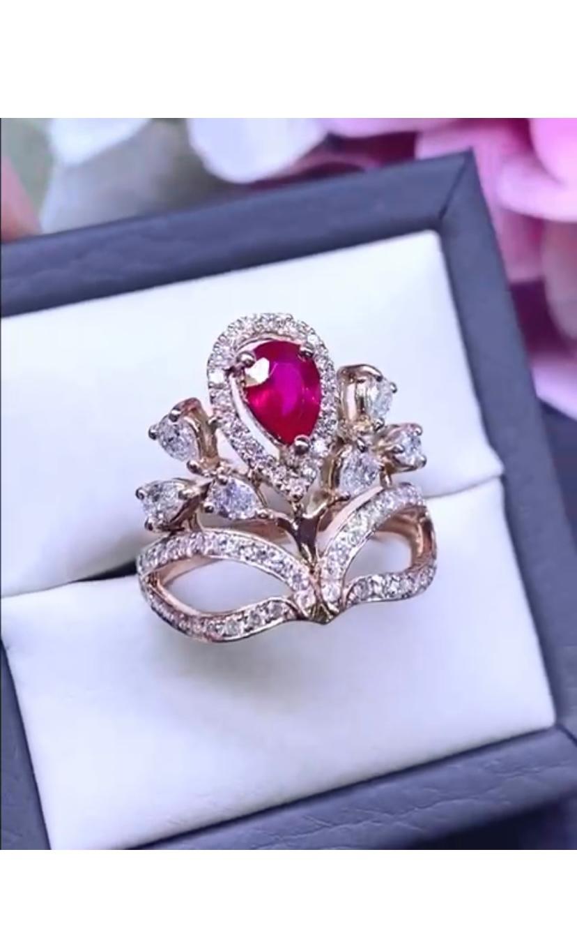 So stunning design and style fir this refined ring in 18k with a unheated ruby from Mozambico of 1,10 carats, pear cut, extra fine quality, spectacular color , and diamonds round brilliant cut of 1,28 carats F/VS.
Handcrafted by artisan