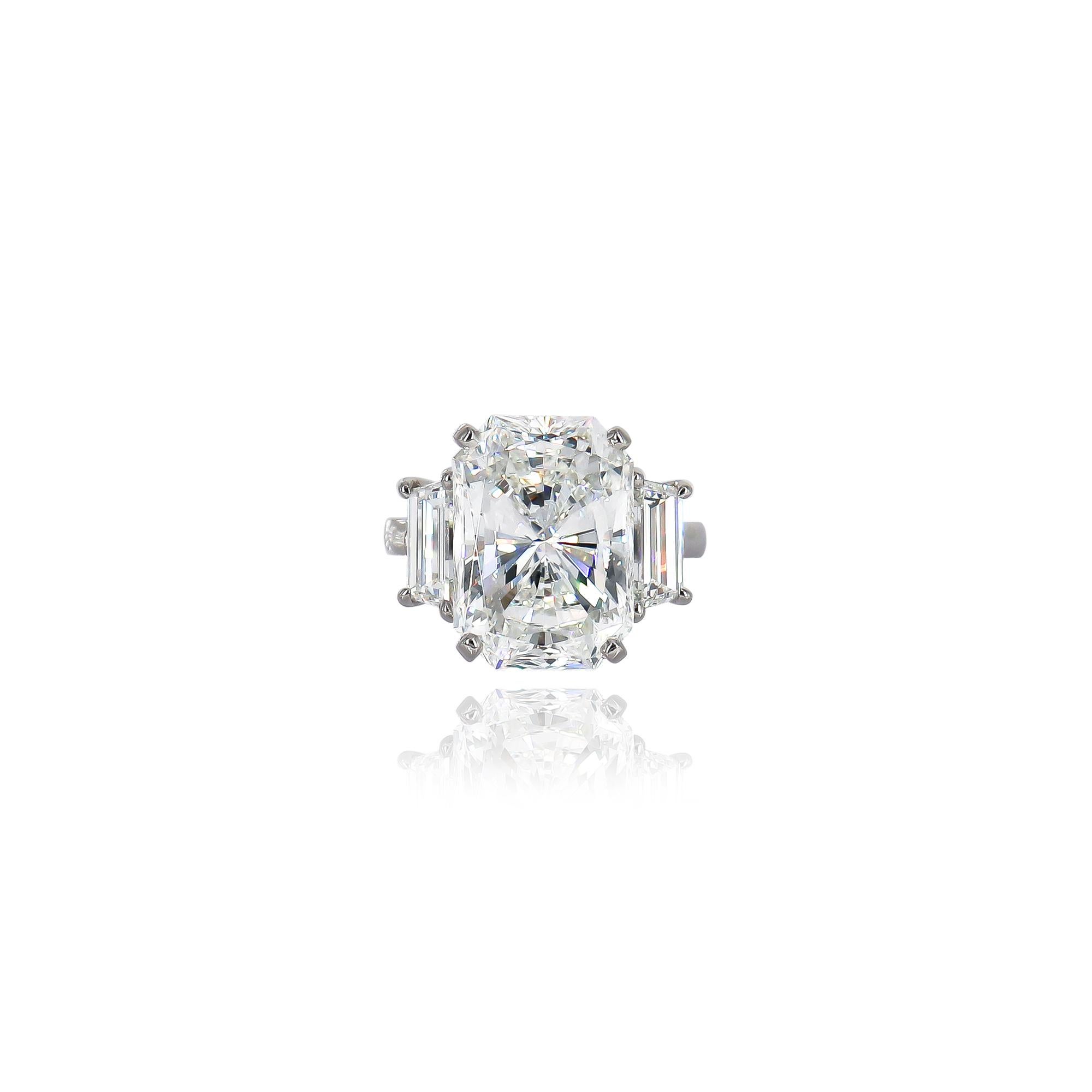 This exquisite, new acquisition by the house of J. Birnbach features a Van Cleef and Arpels 10.03 carat radiant cut diamond of F color and VS2 clarity as described by GIA grading report #1226790135. Set in a signed, platinum, three-stone ring with