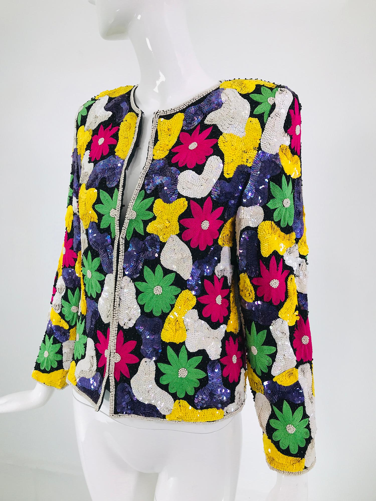 Amazing & vibrant floral sequin silk jacket from the late 1970s. This beautiful jacket is encrusted in sequins in bright primary colours, with pearl trim and black beads. Long sleeved jacket with hidden hook & eye closures done on black silk, lined