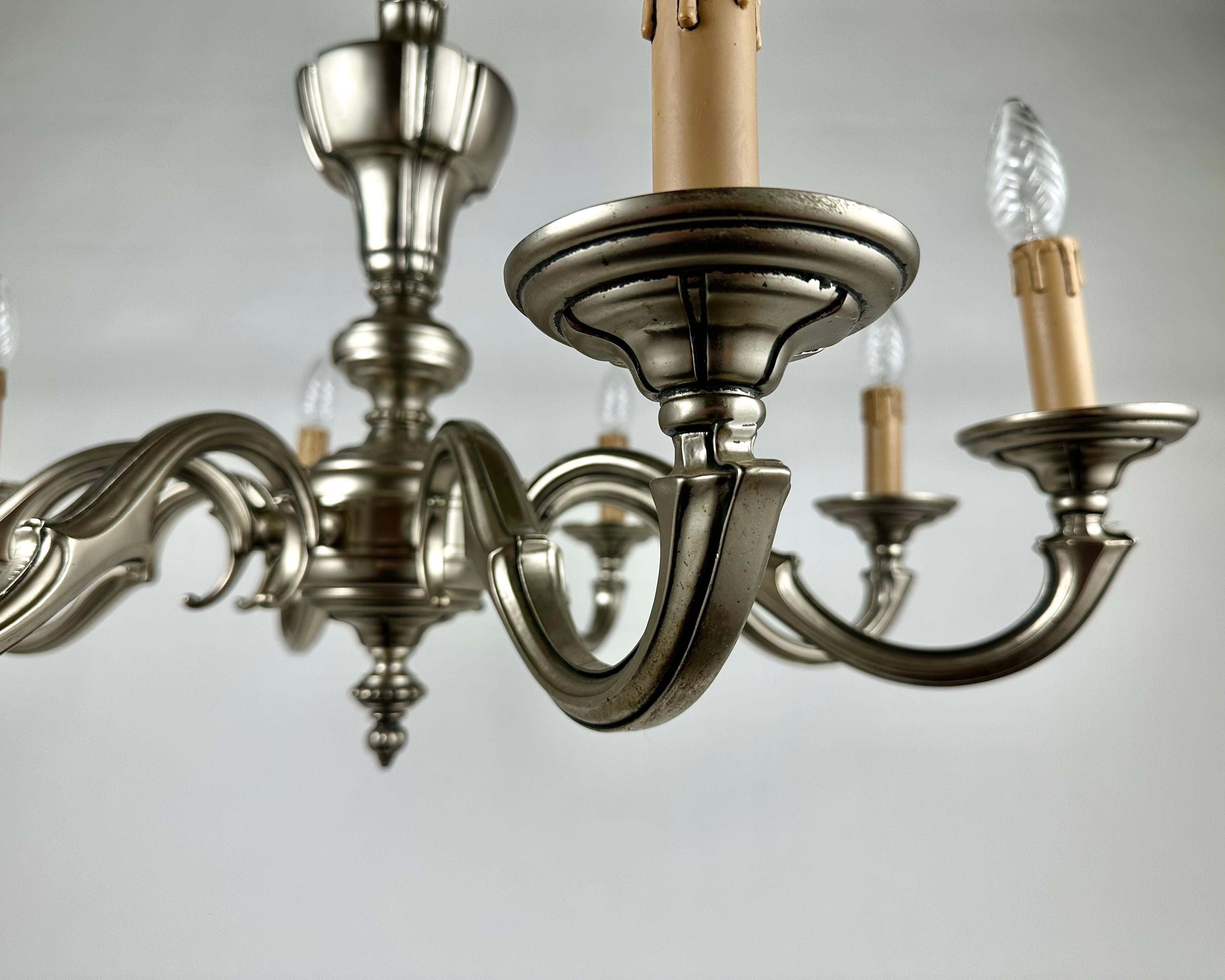 Vintage Bronze Chandelier on the chain. For 8 light bulbs.

Belgium, circa 1970s.

The chandelier is completely made of bronze characterized by exquisite chiseled work, on the horns decorative hats 