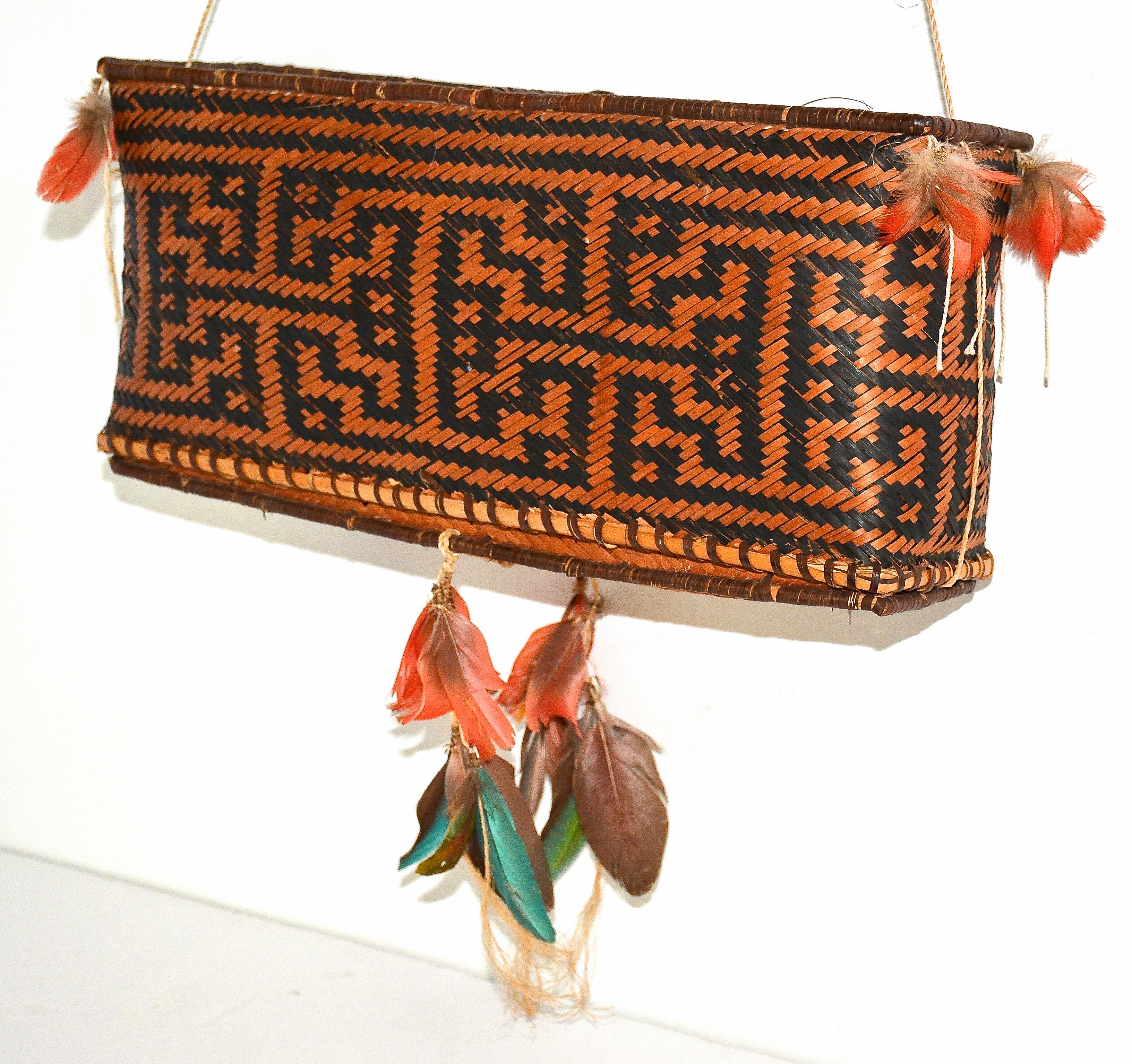 Feather storage basket
Rikbaktsa Tribe, Jurene River, Mato Grosso, Brazil
1990
Plaited fiber, wood, feathers, twined natural fiber, and cotton.
5 inche H. x 12 inches L. x 3 inches W.