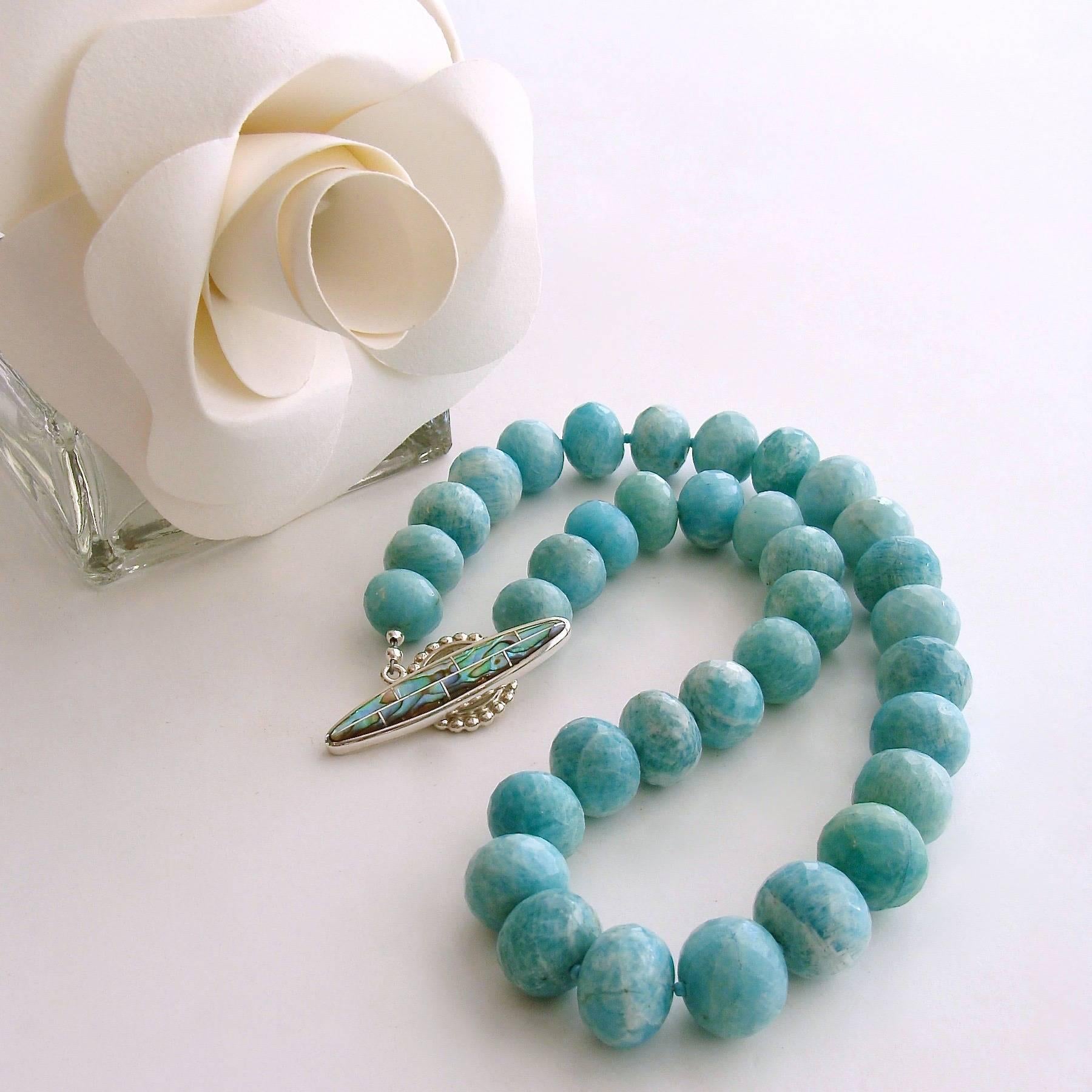 Amanda Necklace.

A gorgeous suite of graduated faceted amazonite rondelles is the basis of this  jaw dropping choker necklace.  Amazonite shares the same soft aqua coloring of natural turquoise, but is a more stable gemstone, which does not