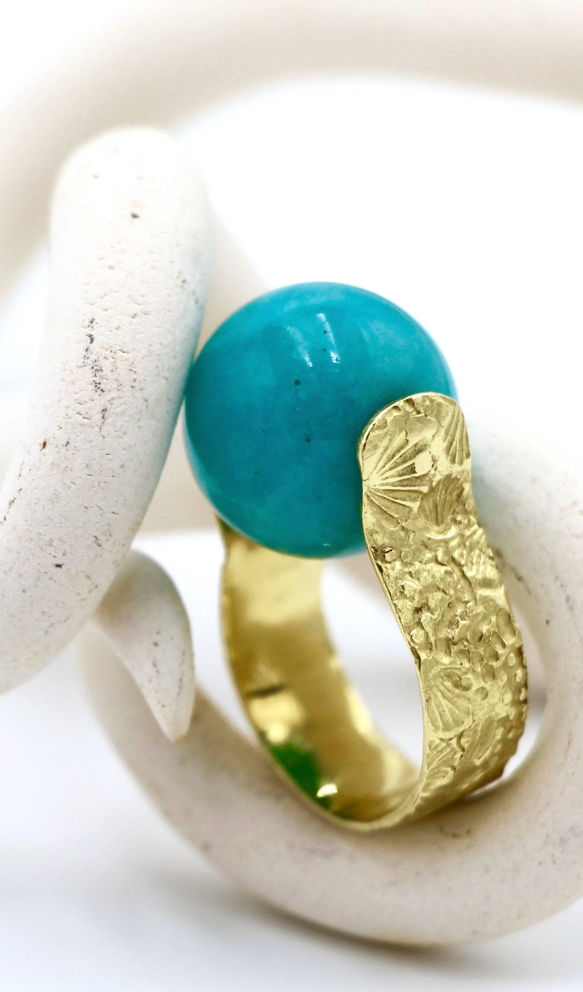 Amazonite Sea Urchin Ring, set in 18 Karat Gold, is stunningly bold statement piece. The unique setting allows for the stone to securely spin.

Dimensions of Amazonite: 18.03mm
Dimensions of Band: 8.31mm x 1.03mm

Ring size*: 9 1/2

*Ring can be