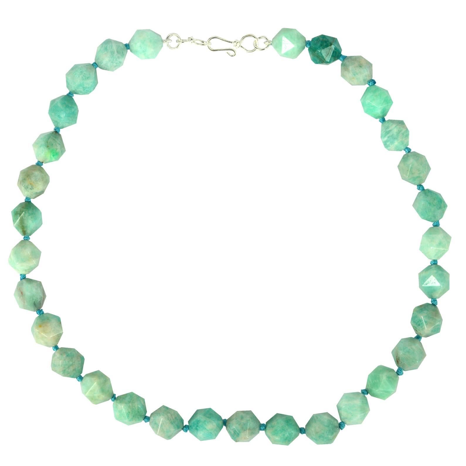 Amazonite Faceted star cut 10mm with a 40mm Sterling Silver hook Clasp 32 beads total.

Finished necklace measures 47.5cm.

Custom modification available on request
Hand knotted on Aqua colored  thread for strength and durability 




