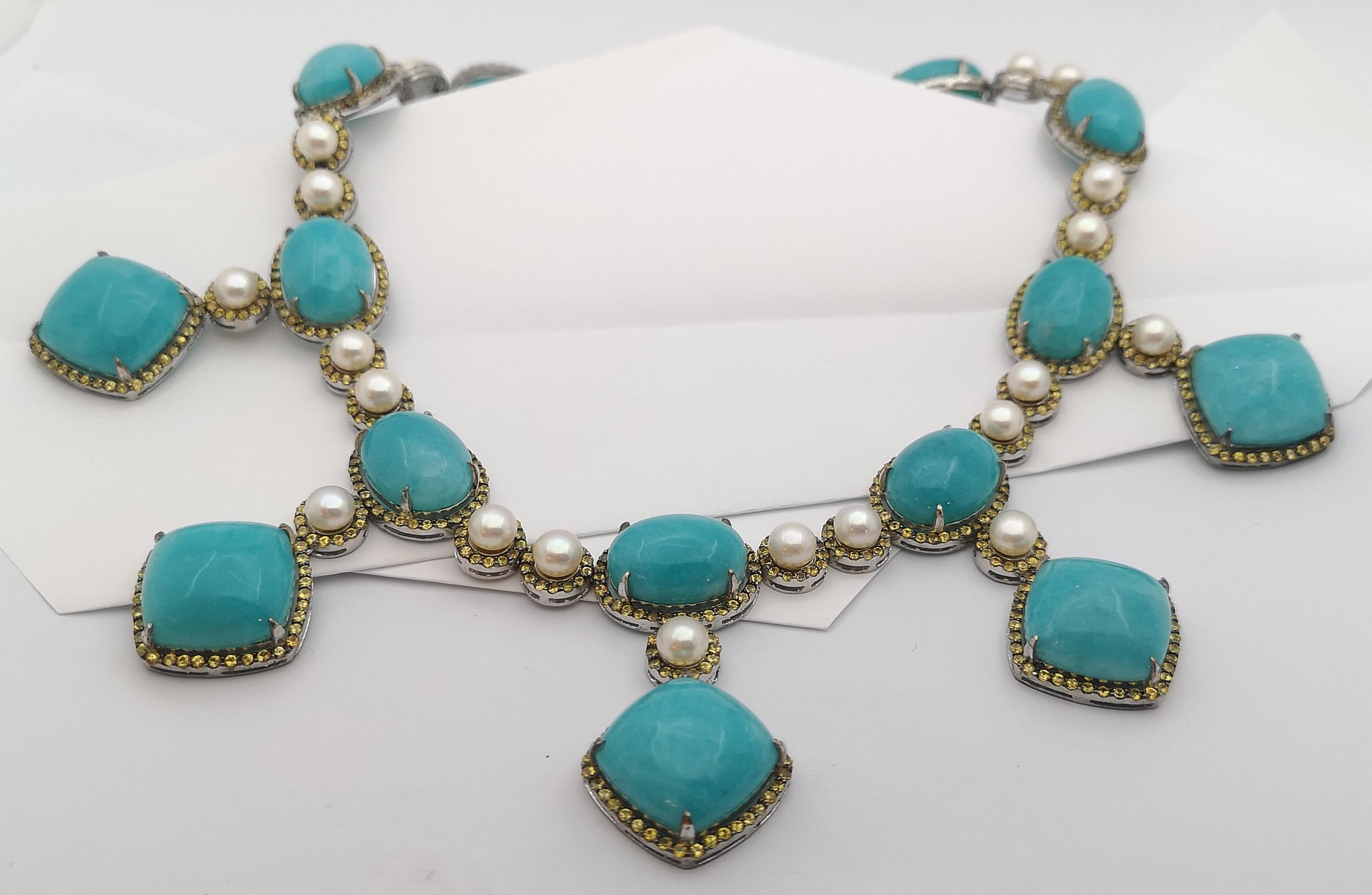 Amazonite, Yellow Sapphire and Pearl Necklace set in Silver Settings

Width:  6.0 cm 
Length:  45.0 cm
Total Weight: 150.84 grams

*Please note that the silver setting is plated with rhodium to promote shine and help prevent oxidation.  However,