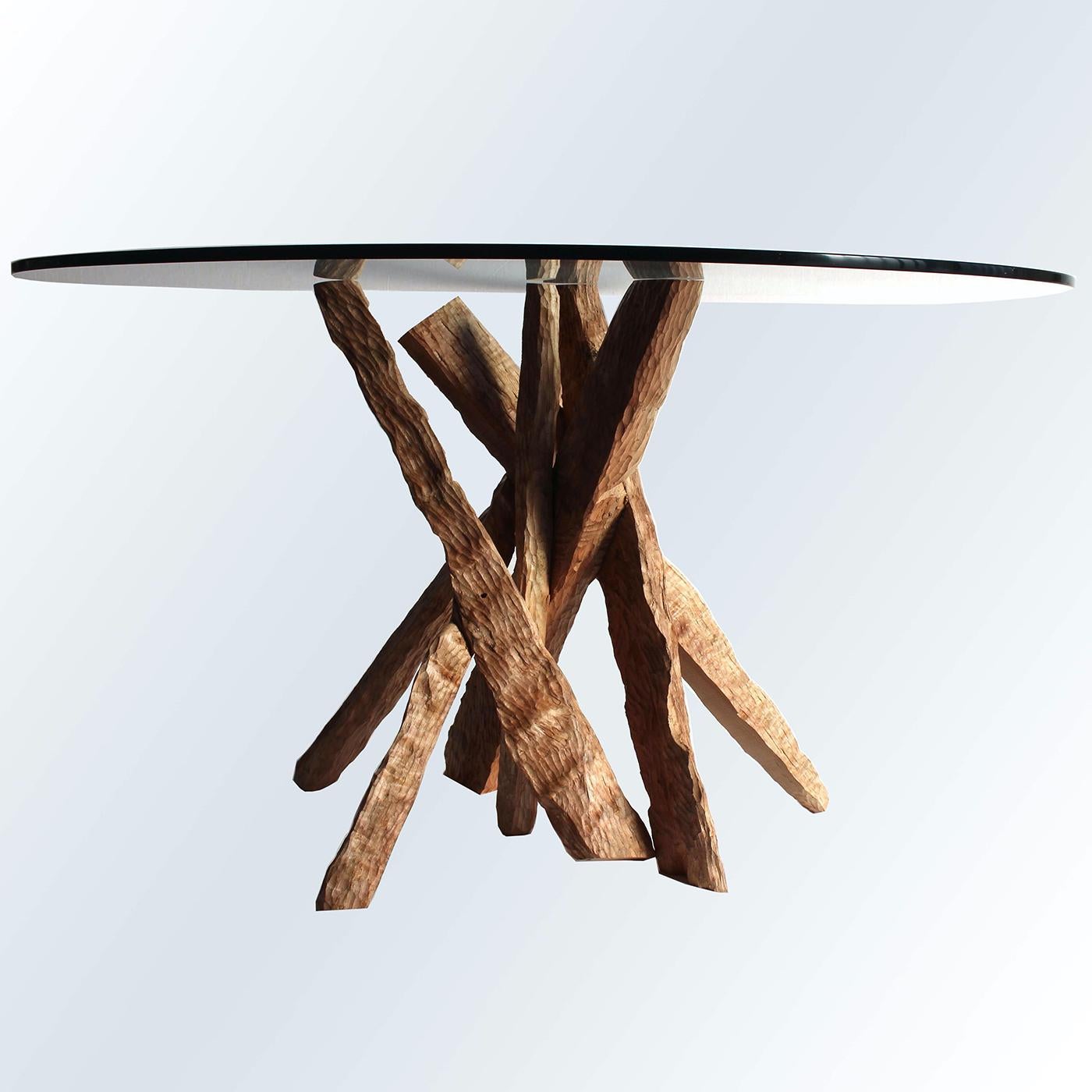This stunning table by Pietro Meccani combines rustic with Minimalist to create a unique aesthetic. Its solid cherrywood base is beautifully hand-sculpted, arranged into an elegant cluster that showcases its natural beauty. Finished with a round