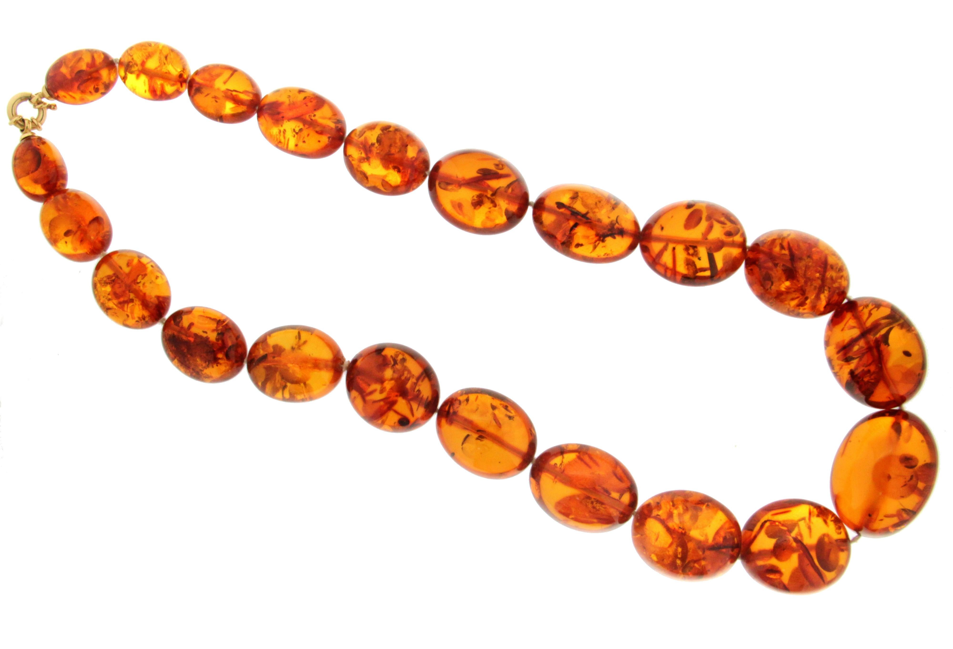 Amber 18 Karat Yellow Gold Rope Necklace
The biggest piece of amber width 3.80 cm and length 2.60 cm
The smallest piece of amber width 2.40 cm and length 1.50 cm

Necklace weight 170 grams
Necklace length 65 cm