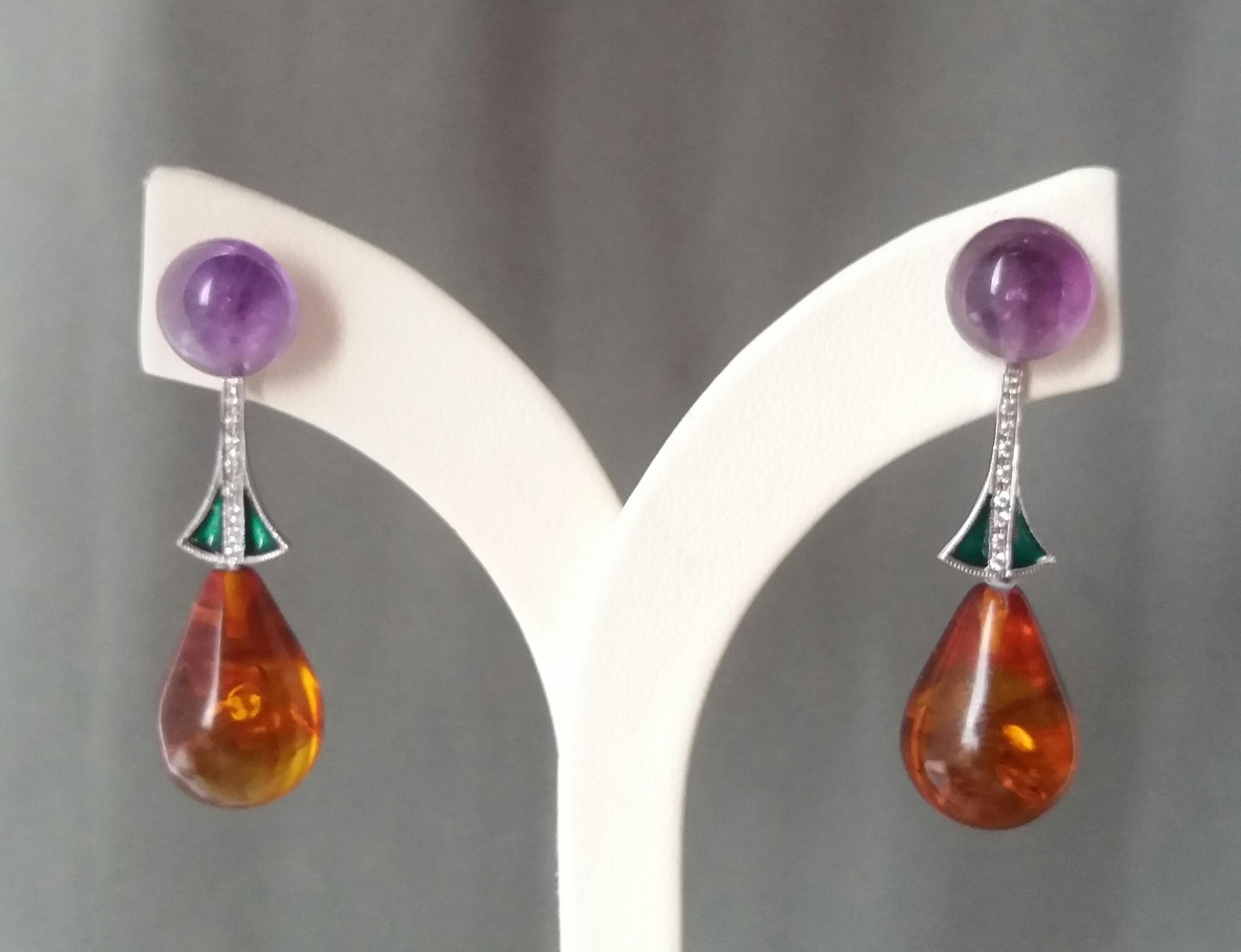 In this pair of earrings 2 round buttons of amethyst diameter 10mm. support 2 elements in white gold diamonds and green enamel, the bottom is composed of 2 Amber round drops size 18 x 12 mm.
In 1978 our workshop started in Italy to make simple-chic