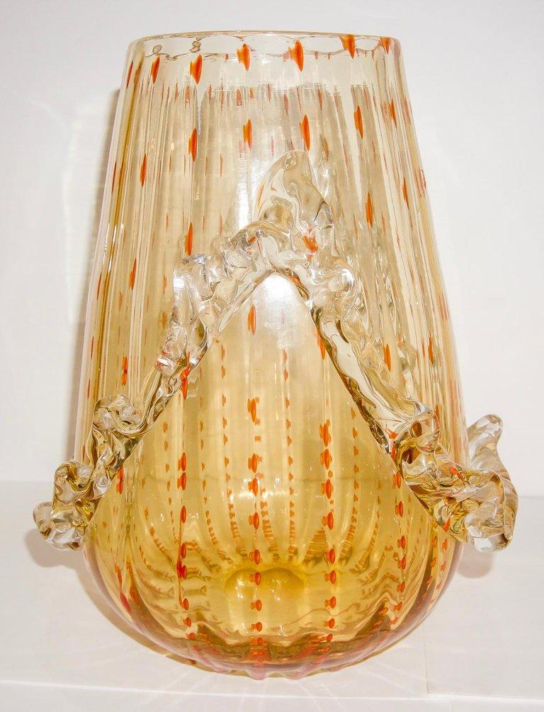 Stunning Murano vase by Barovier and Toso.  Amber with orange flecks and ruffled details. Circa 1930's-1940's.

Please feel free to contact us directly for any additional information or a shipping quote by clicking 