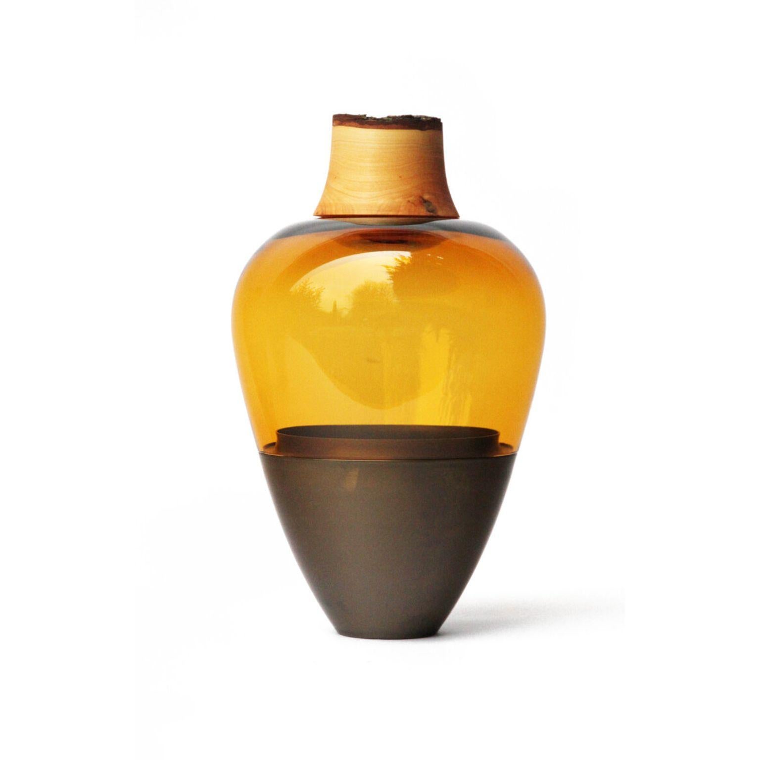 Amber and Patinated Brass Sculpted Blown Glass India Vessel, Pia Wüstenberg
Dimensions: height 20 x diameter 38 cm.
Materials: hand blown glass, brass.

Pia Wüstenberg, Utopia
Pia Wüstenberg is a creative with a passion for materials and craft. She