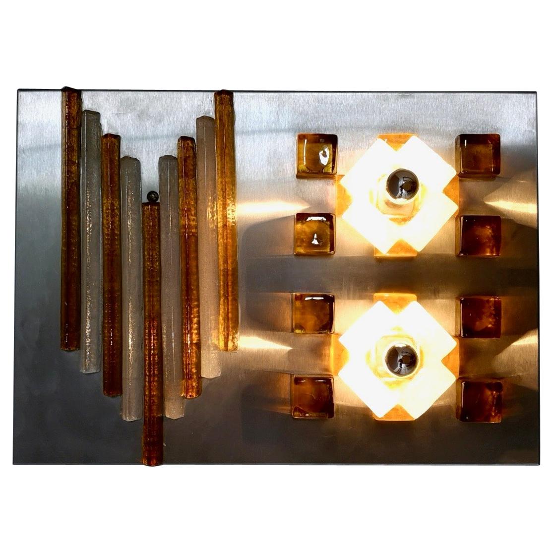 This wall light is made in Murano glass and glazed steel.
It might show slight traces of use since its vintage, but its wiring is new and it can be considered as in excellent original condition and ready to give ambiance to any room.

Measures: