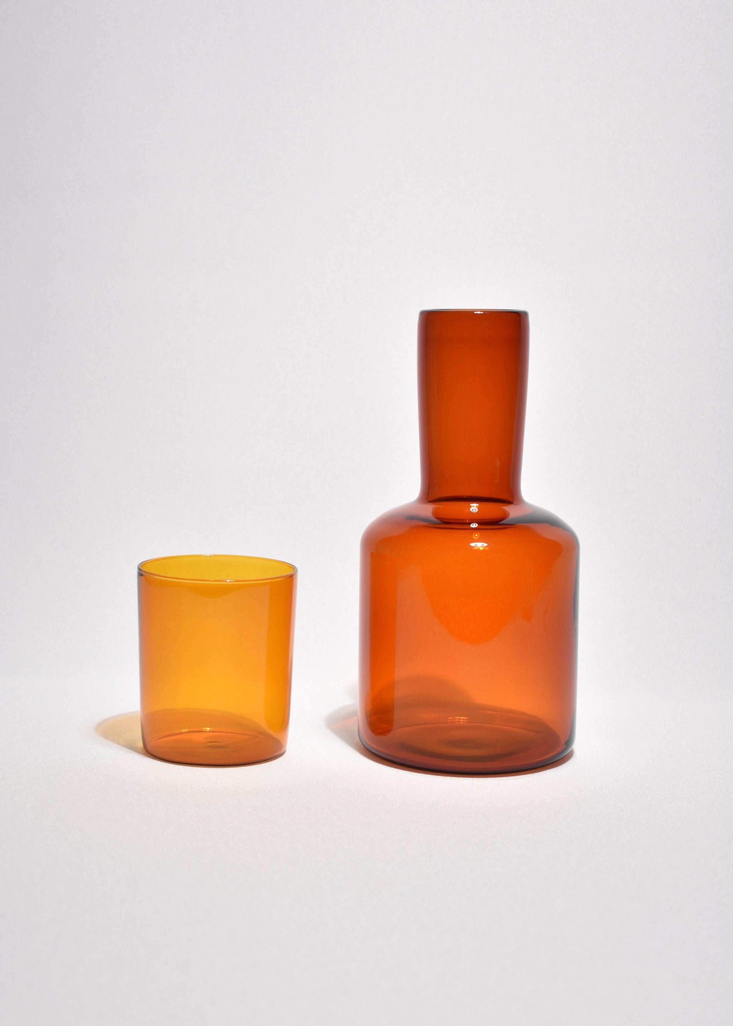 Amber carafe set by Maison Balzac inspired by the traditional sets used in France and displayed on a bedside table at night. 

Food grade colored glass, individually mouth blown. 
Heat and cold resistant.
Hand wash