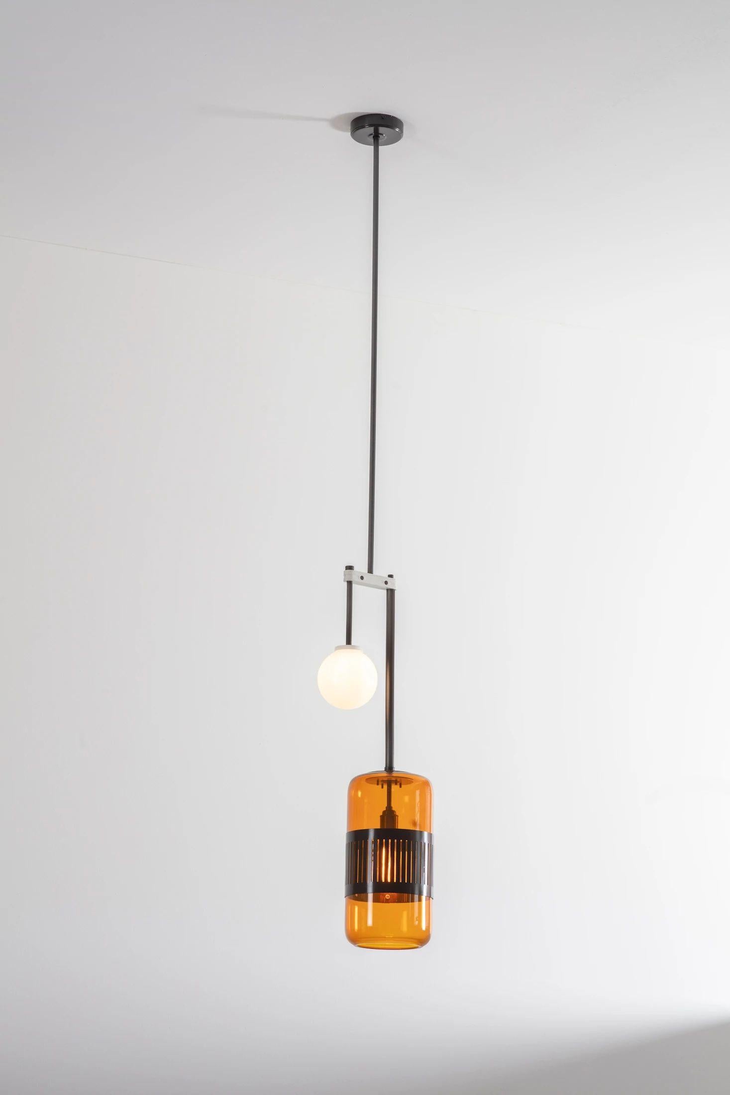 Amber bronze Lizak drop pendant by Bert Frank
Dimensions: D 78 x W 27 x H 78 cm
Materials: bronze and glass

Available finishes: brass, opal and blue
All our lamps can be wired according to each country. If sold to the USA it will be wired for