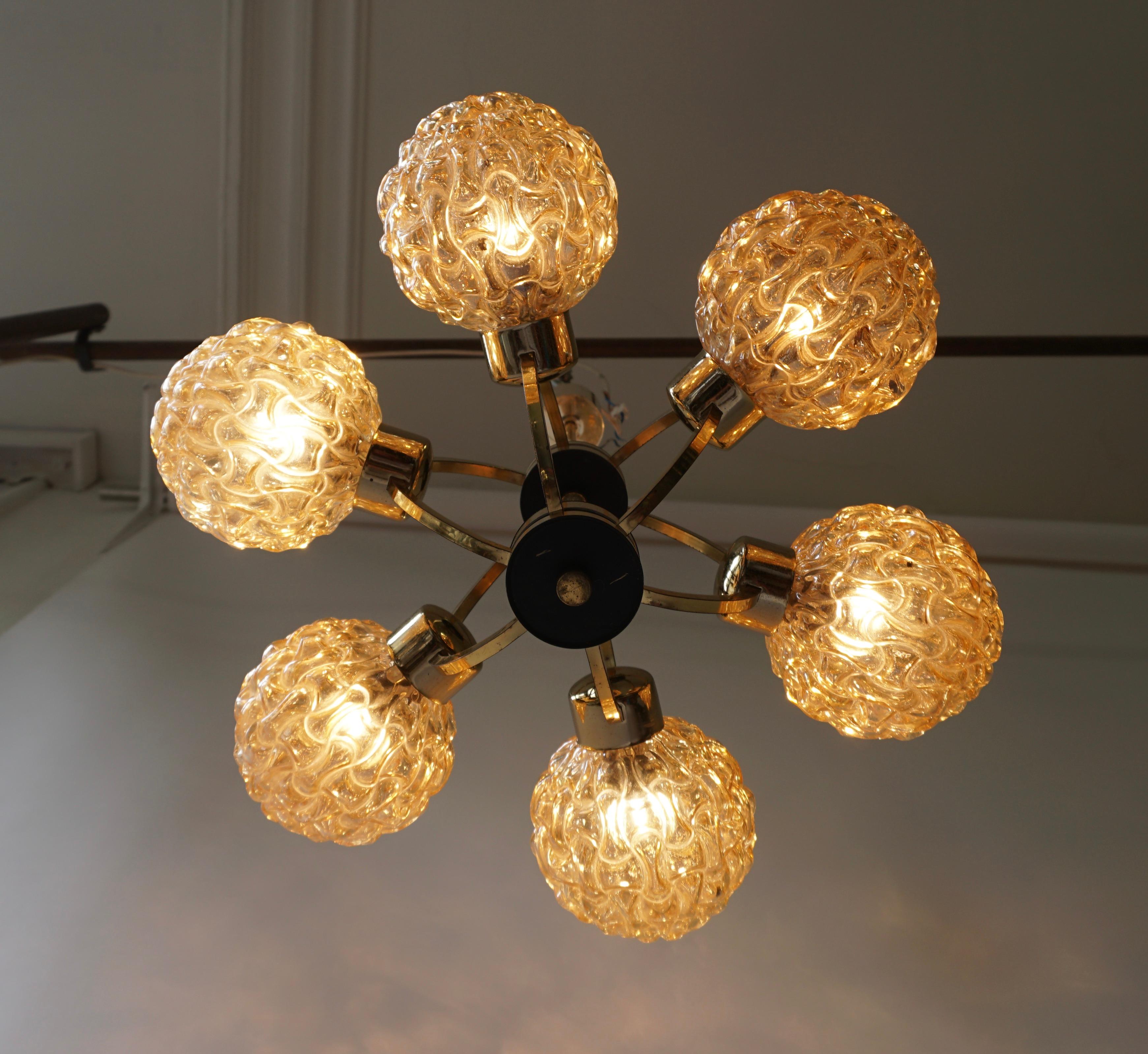 Beautiful bubble glass chandelier or pendant light designed by Helena Tynell for Glashu¨tte Limburg. A design Classic, the amber colored or toned hand blown glass gives a wonderful warm glow. 

Helena Tynell is a finish glass and ceramics