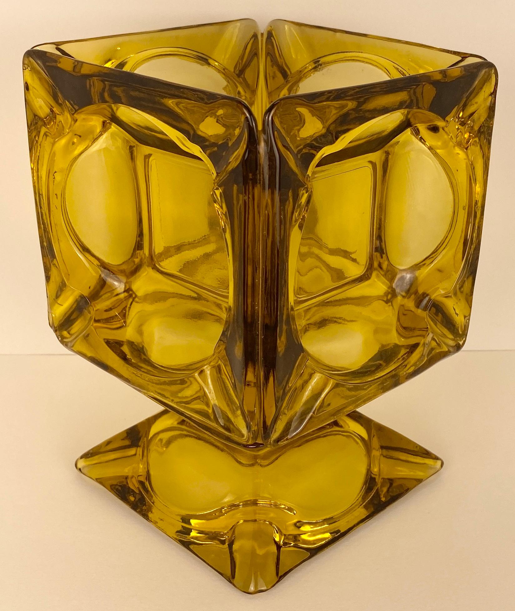 An amber colored glass vase made from various vintage ashtrays. 
This interesting art glass vase is very unique. 

Measures: 6 1/2