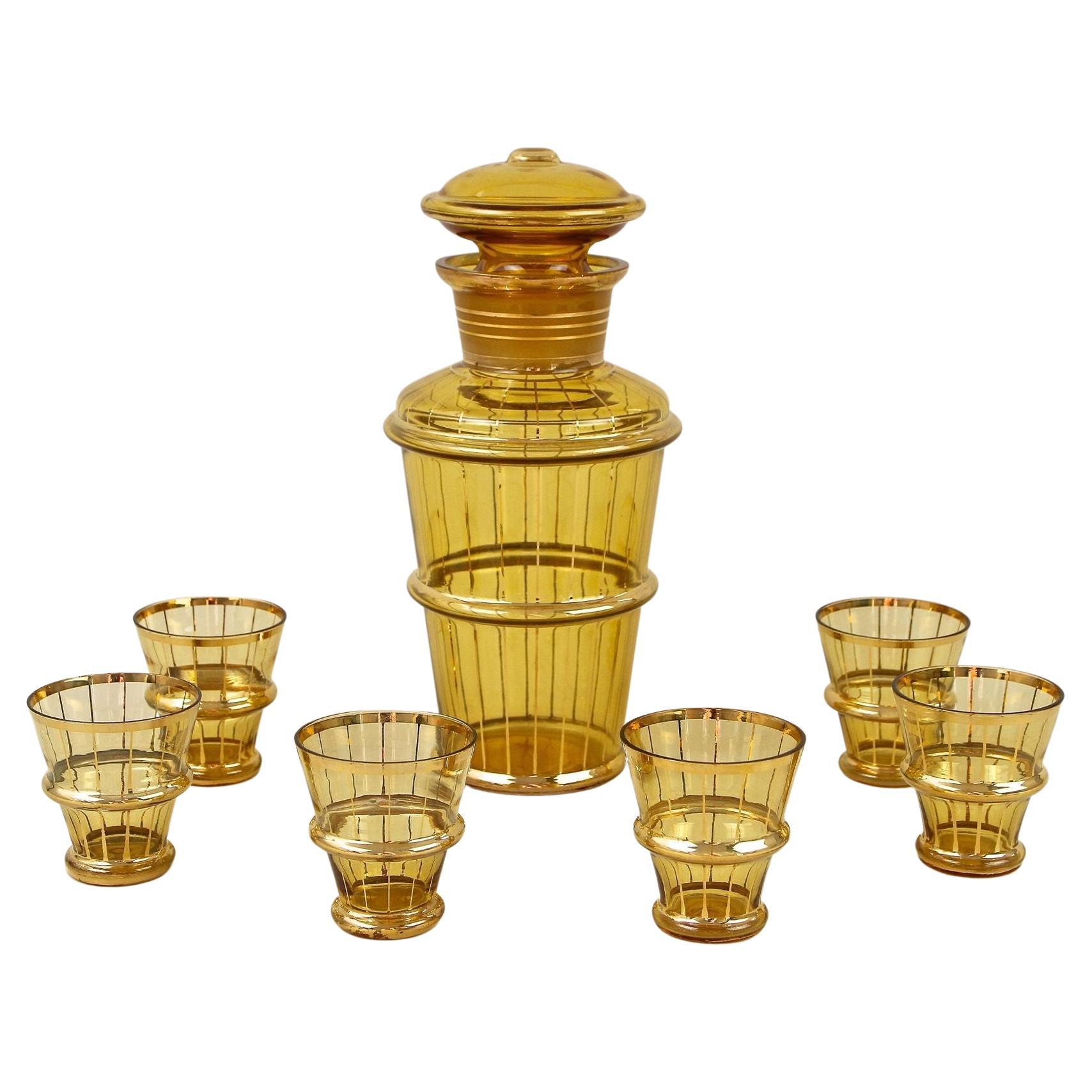Amber Colored Gilt Art Deco Glass Decanter Set with 6 Shot Glasses, CZ ca. 1920 For Sale