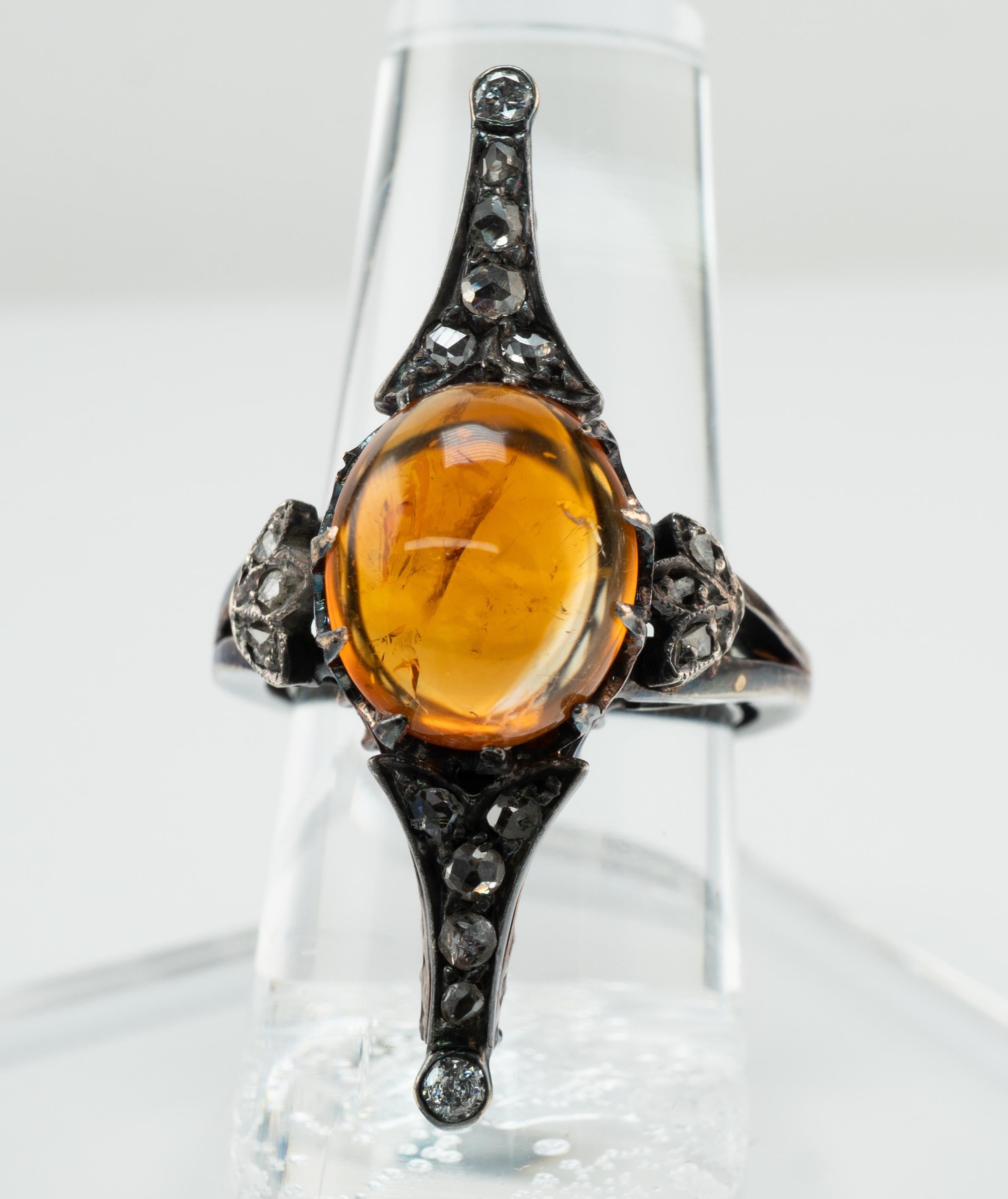 Amber Diamond Ring Elongated 14K White Gold and Sterling Silver Antique

This old antique ring is crafted in solid 14K white blackened gold and Sterling Silver for the top.
The metal was carefully tested with acid and also electronically and