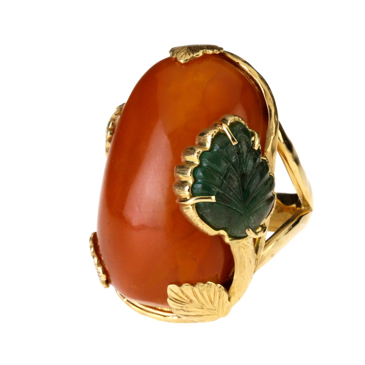  Cabochon butterscotch amber ring, with emerald carved leaf on the side, carved yellow gold with leaf motif, very unique pieces gold gr.15,60 measure 15eu.
All Giulia Colussi jewelry is new and has never been previously owned or worn. Each item will
