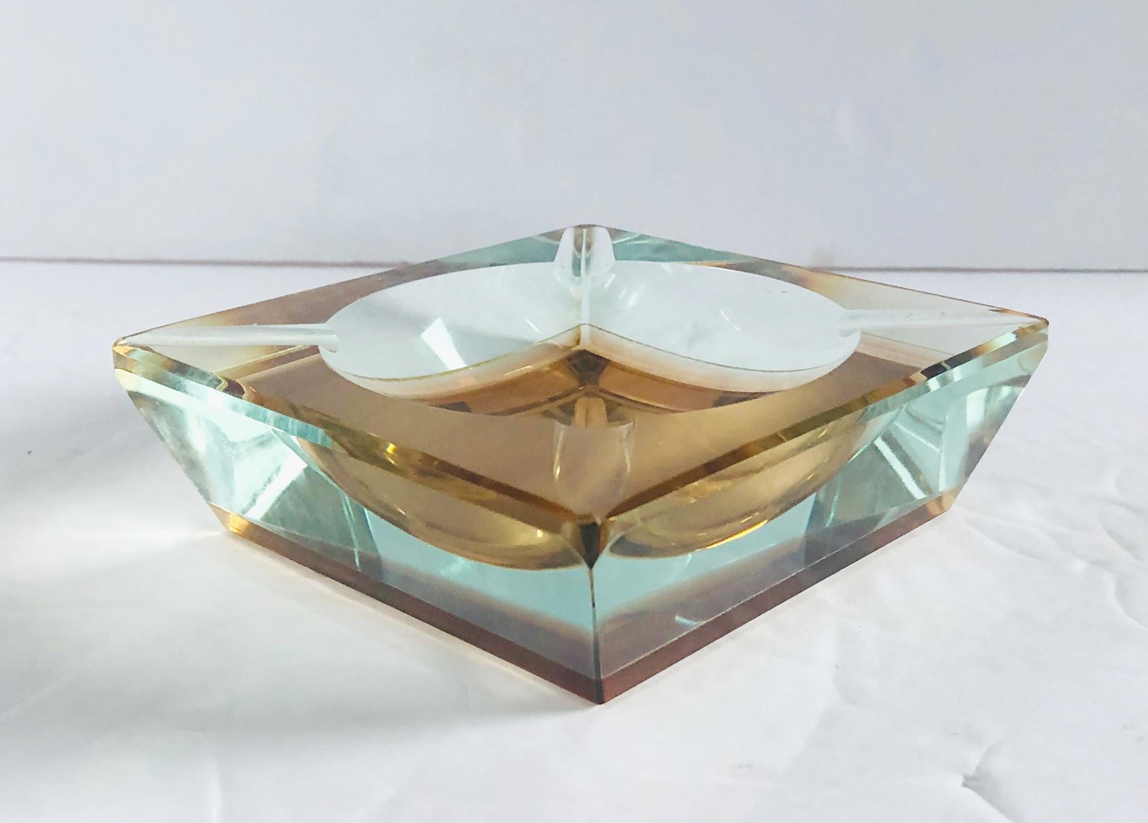 Vintage Italian amber faceted Murano glass ashtray blown in Sommerso technique / Designed by Mandruzzato circa 1960s / Made in Italy
Length: 4.75 inches / Width: 4.75 inches / Height: 1.5 inches
Order Reference #: FABIOLTD G110
This piece makes for
