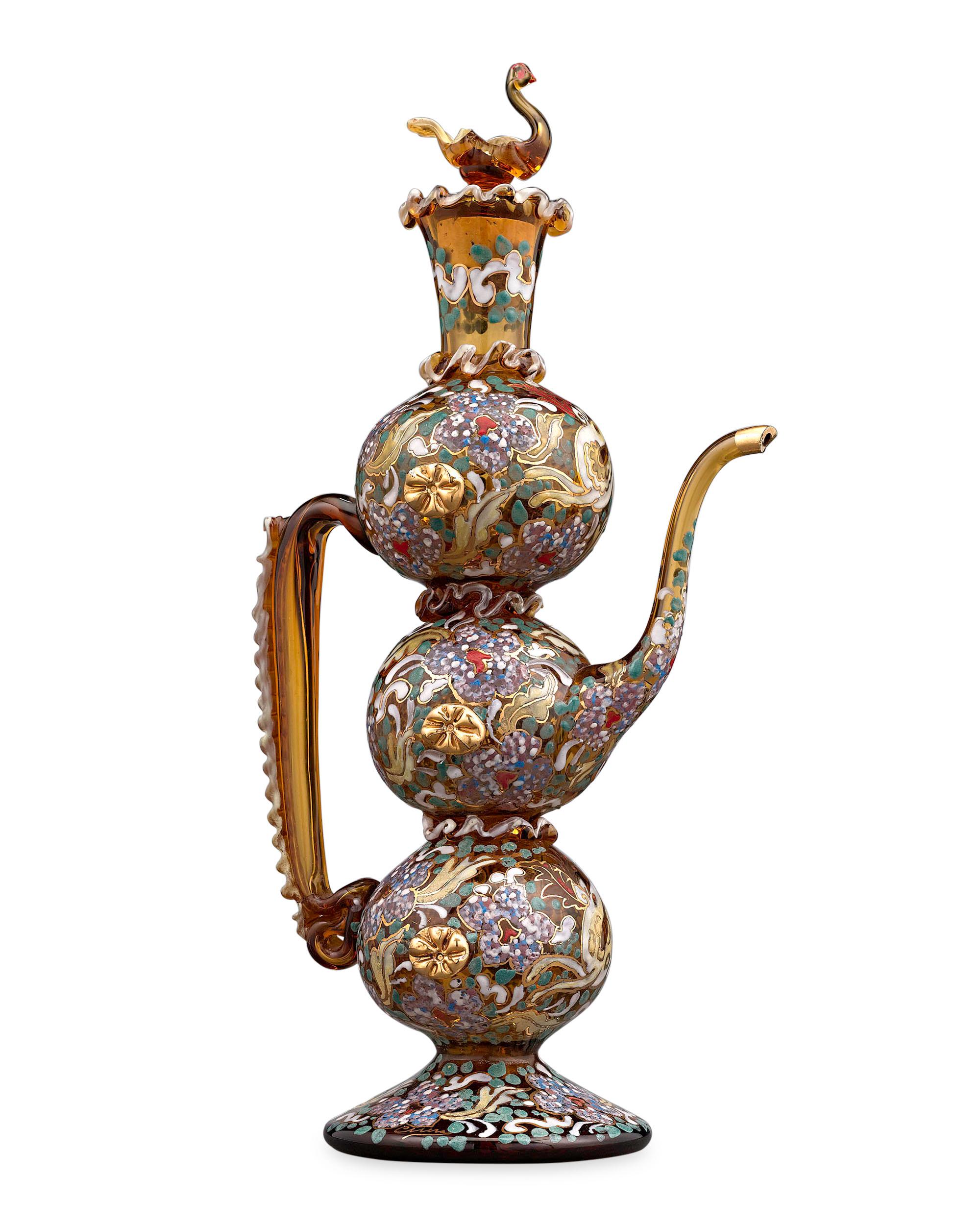 This delightful amber glass coffee pot is a wonderful example of the incredible enamelwork of the legendary Moser glassmakers. An enchanting floral and foliate enamel design graces the body of this exquisitely constructed piece, which features a