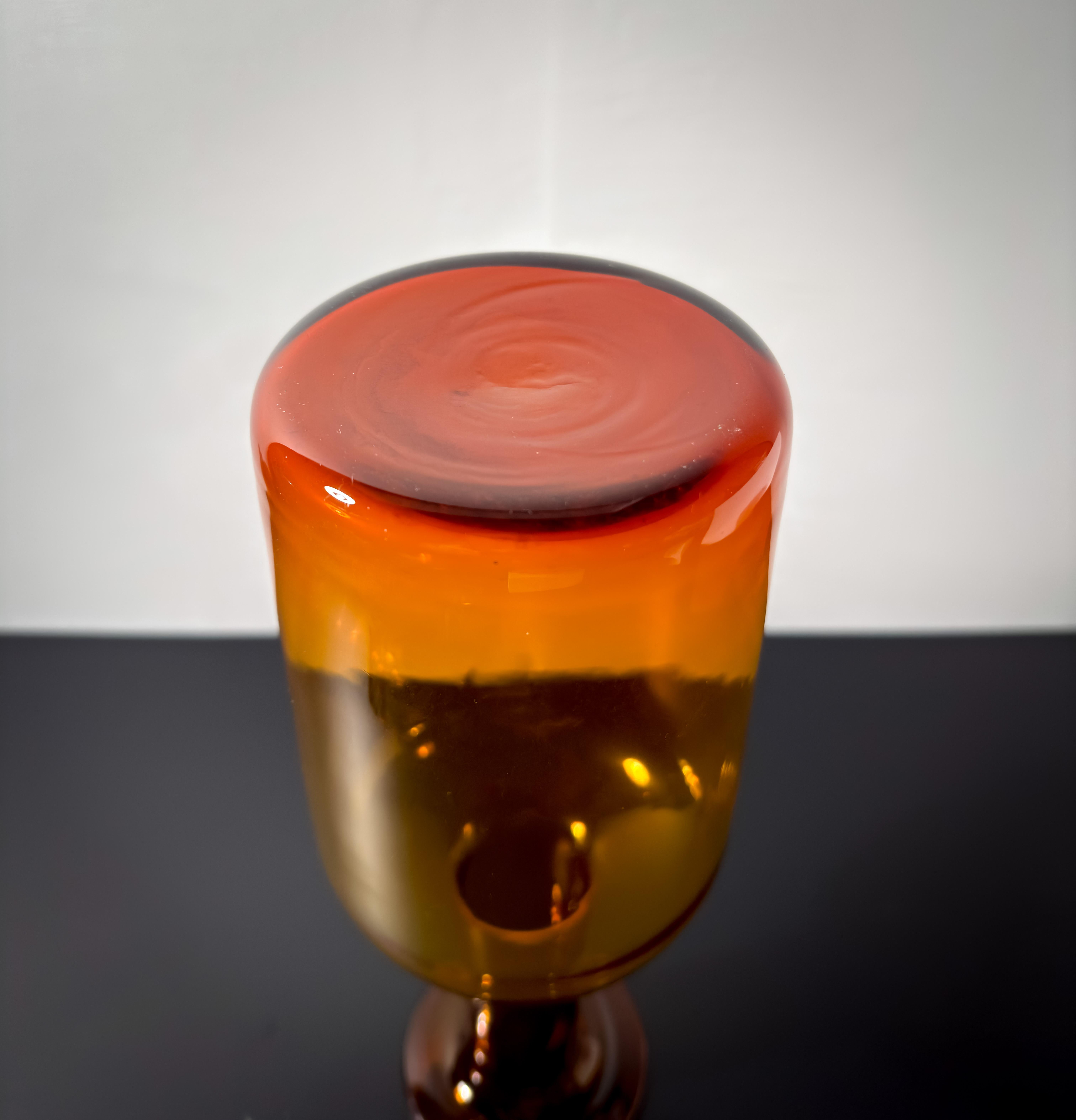 


Danish Mid-Century Amber Glass Bottle Vase by Otto Brauer for Holmegaard

A design icon and a superb example of mid-20th-century modern glass. Crafted during the 1960s, the vase features a clean, understated profile, with a rounded base that