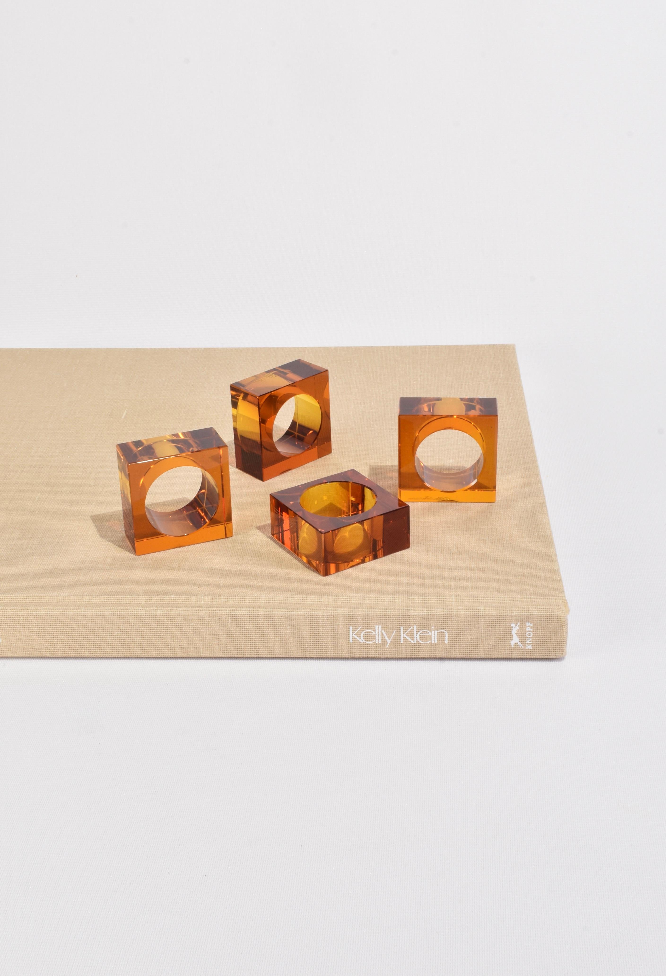 Beautiful crystal amber glass napkin ring set of four. Signed, Oleg Cassini.