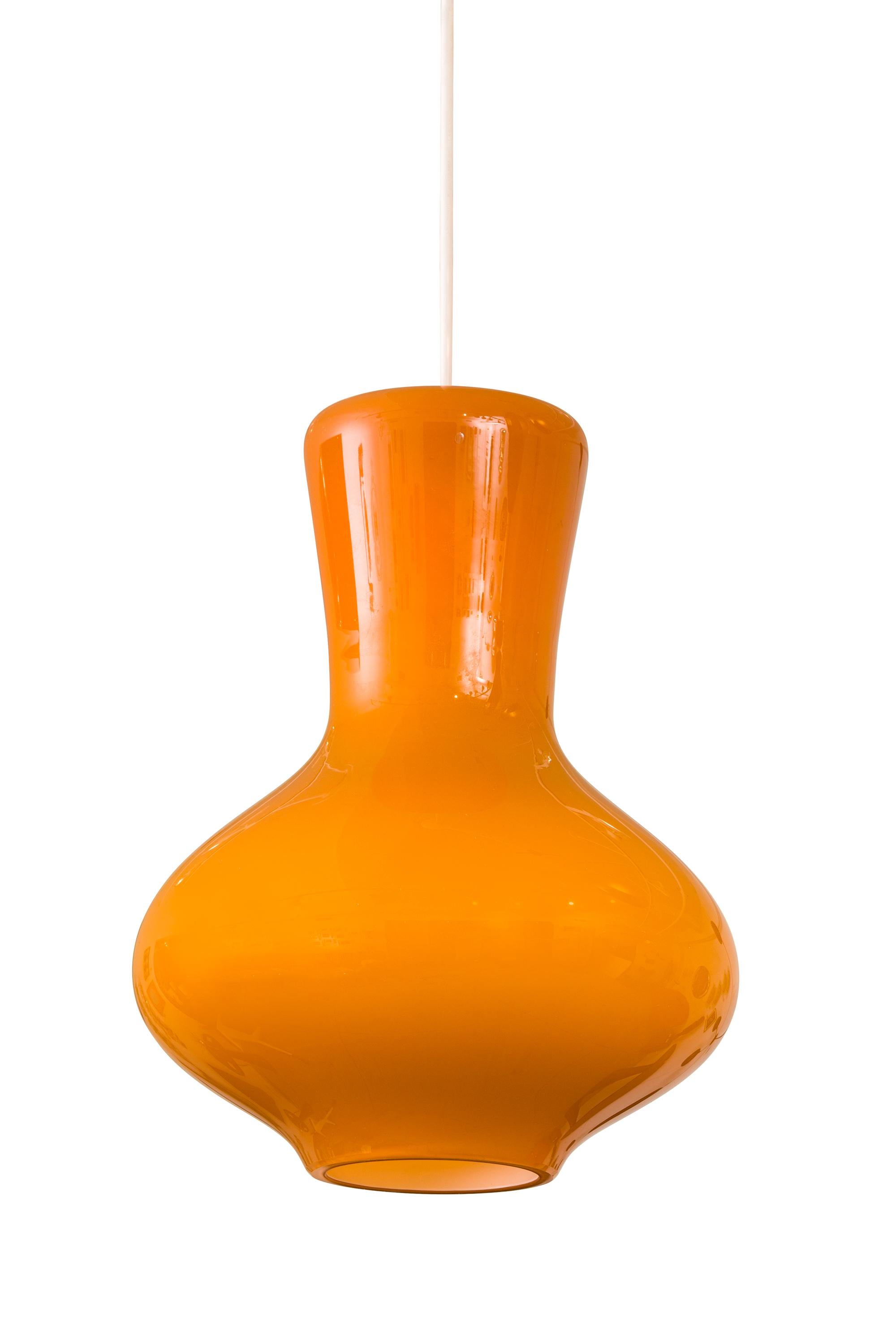 A classic simple glass pendant light with a wonderfully warm color.