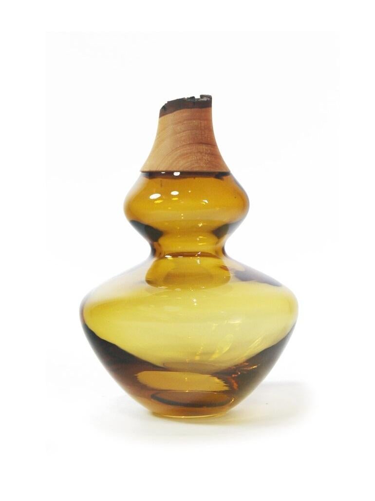 Amber Inanna stacking vessel, Pia Wüstenberg
Dimensions: D 14.5 x H 22
Materials: glass, wood
Available in other colors.

Inanna is an ancient Mesopotamian goddess associated with love, beauty, justice and political power. A strong symbol for