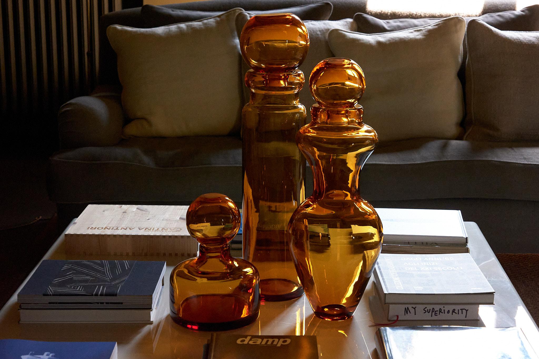 Amber Marsala Cap and Vase by Studio Bojola
Dimensions: D 22 x H 58 cm
Materials: Pure crystal. Colour: Amber. 
Weight: 8 kg. 

The Ustica is a combination of two vases, serving as both a sculptural crystal piece and a flower vase. The rounded top,