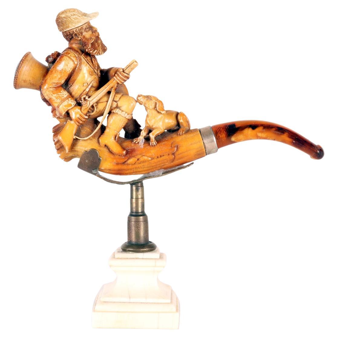 Pipa di meerschaum in ambra, raffigurante un cacciatore. Vienna, Austria 1890.