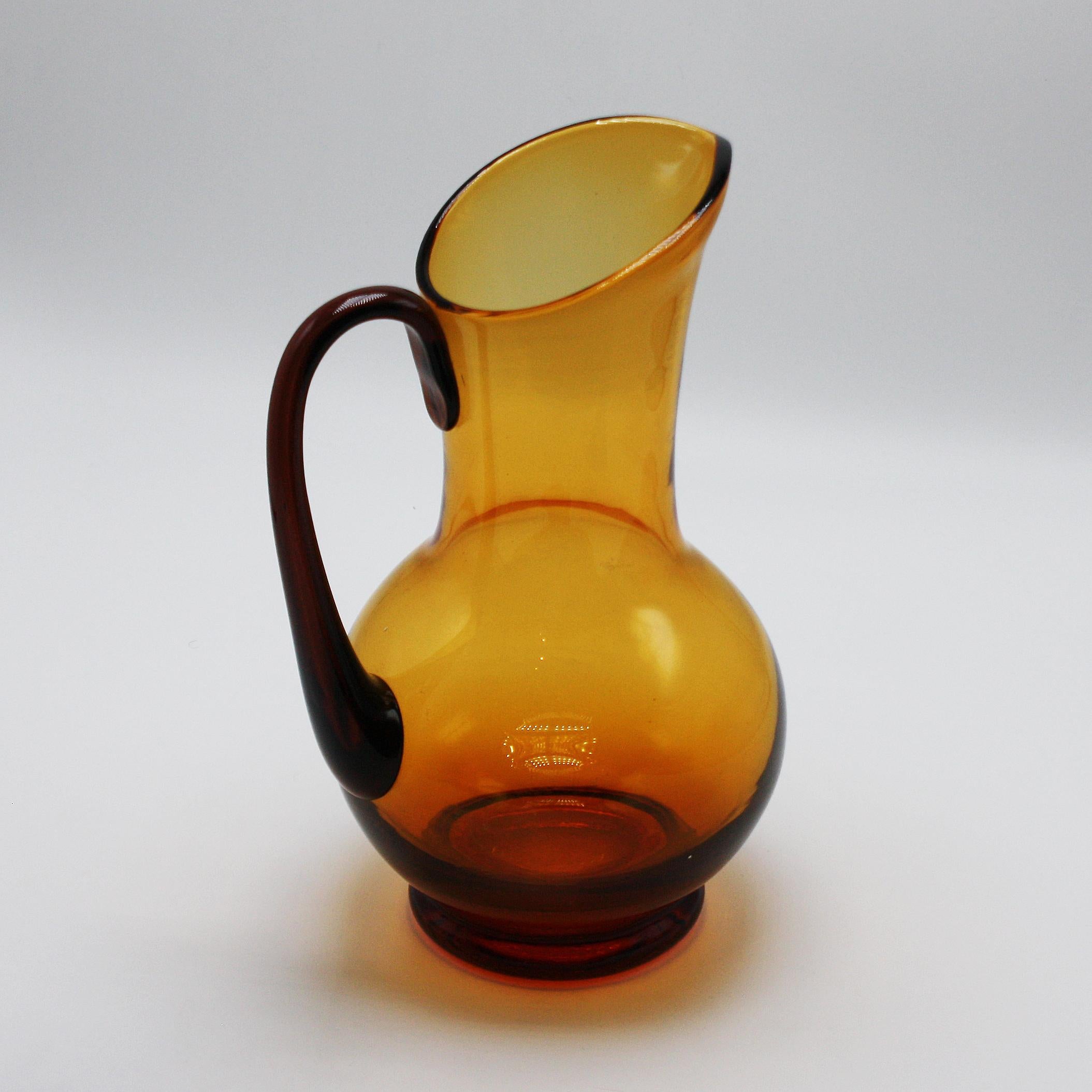 Amber Murano glass pitcher with amethyst handle, circa 1940.
$525.
