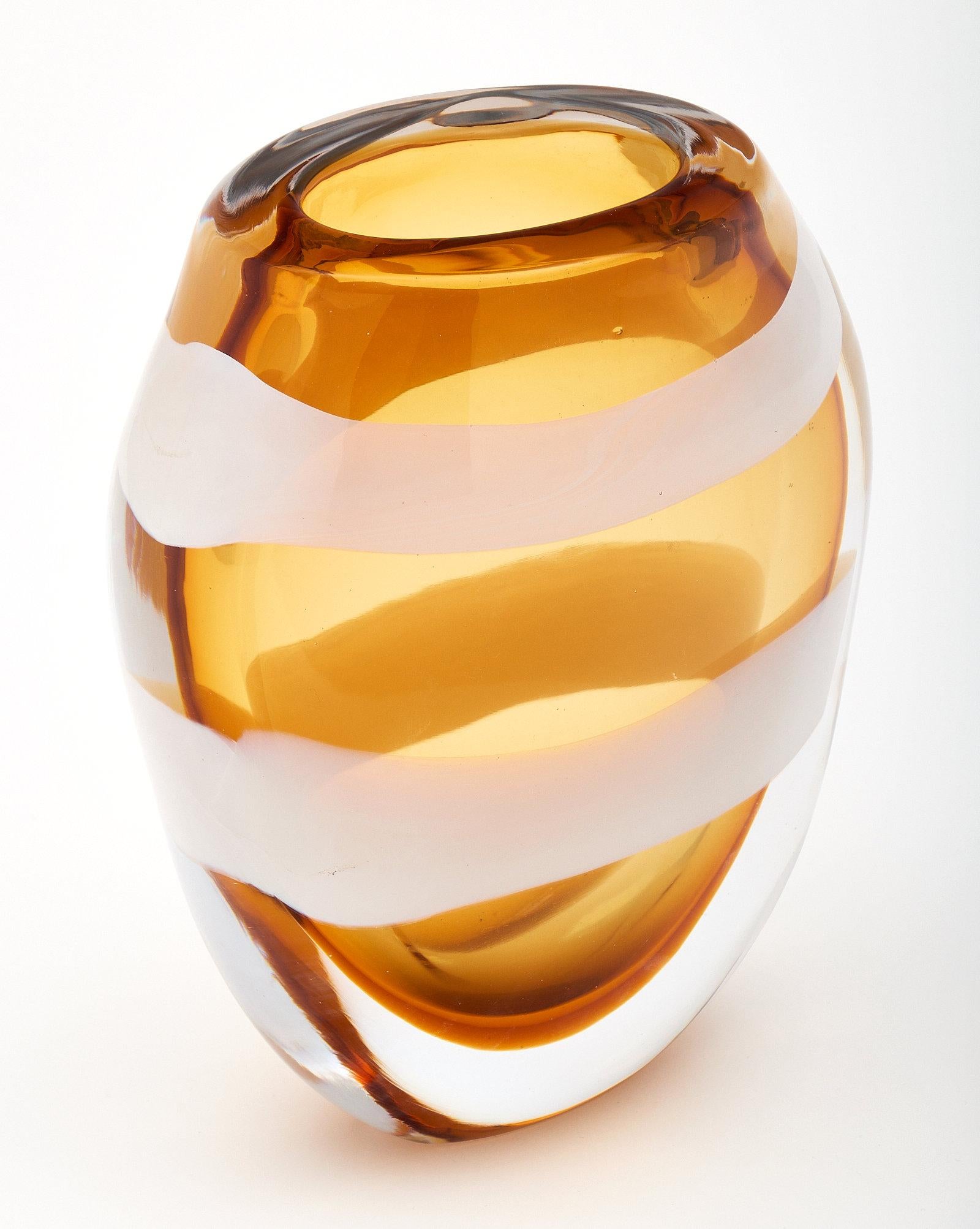 Vintage Murano glass amber vase by maestro Pino Signoretto. This beautiful vase is made of amber colored glass with opaline swirls. It has been signed by maestro Pino Signoretto!