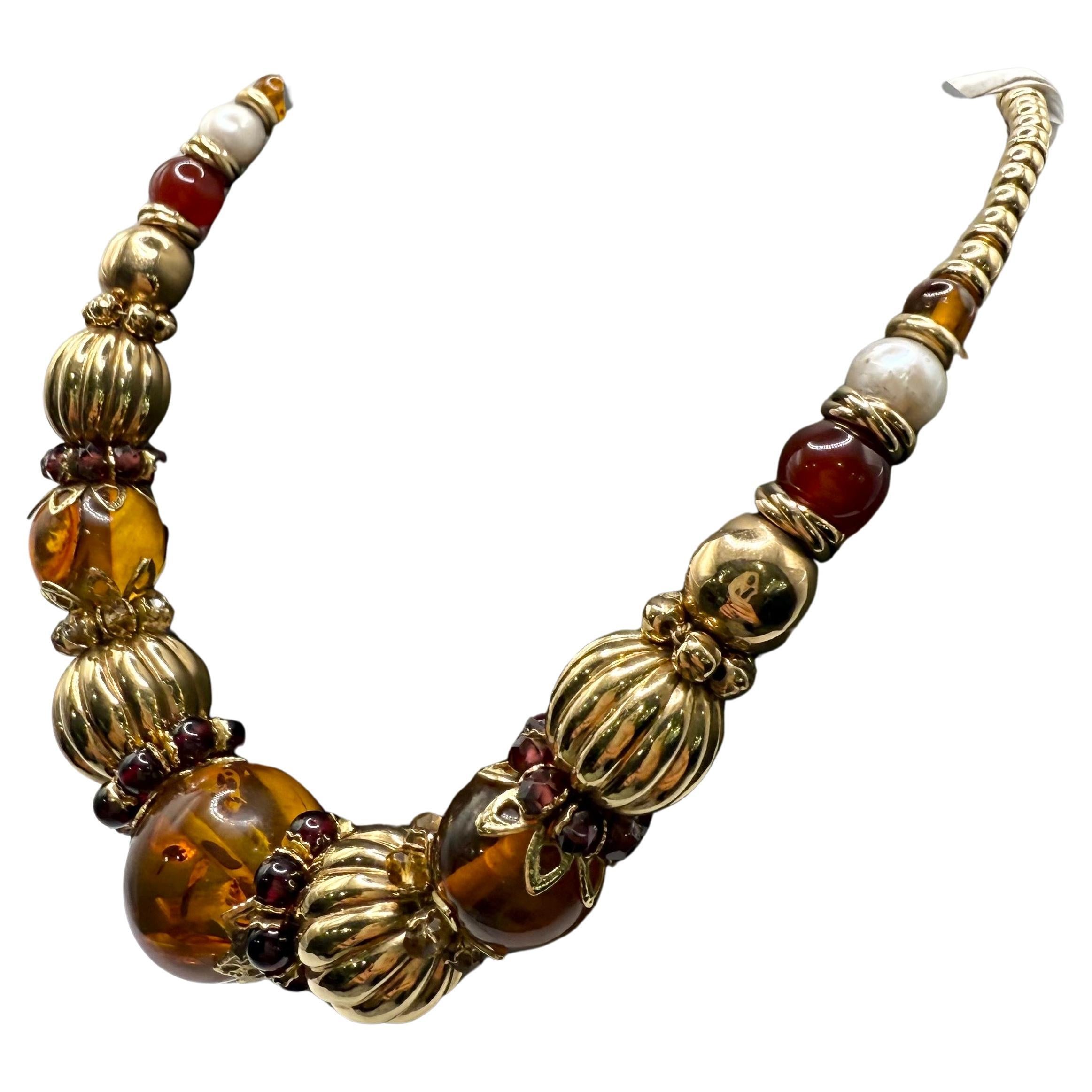 Collana e bracciale d
ambra in oro 14KT