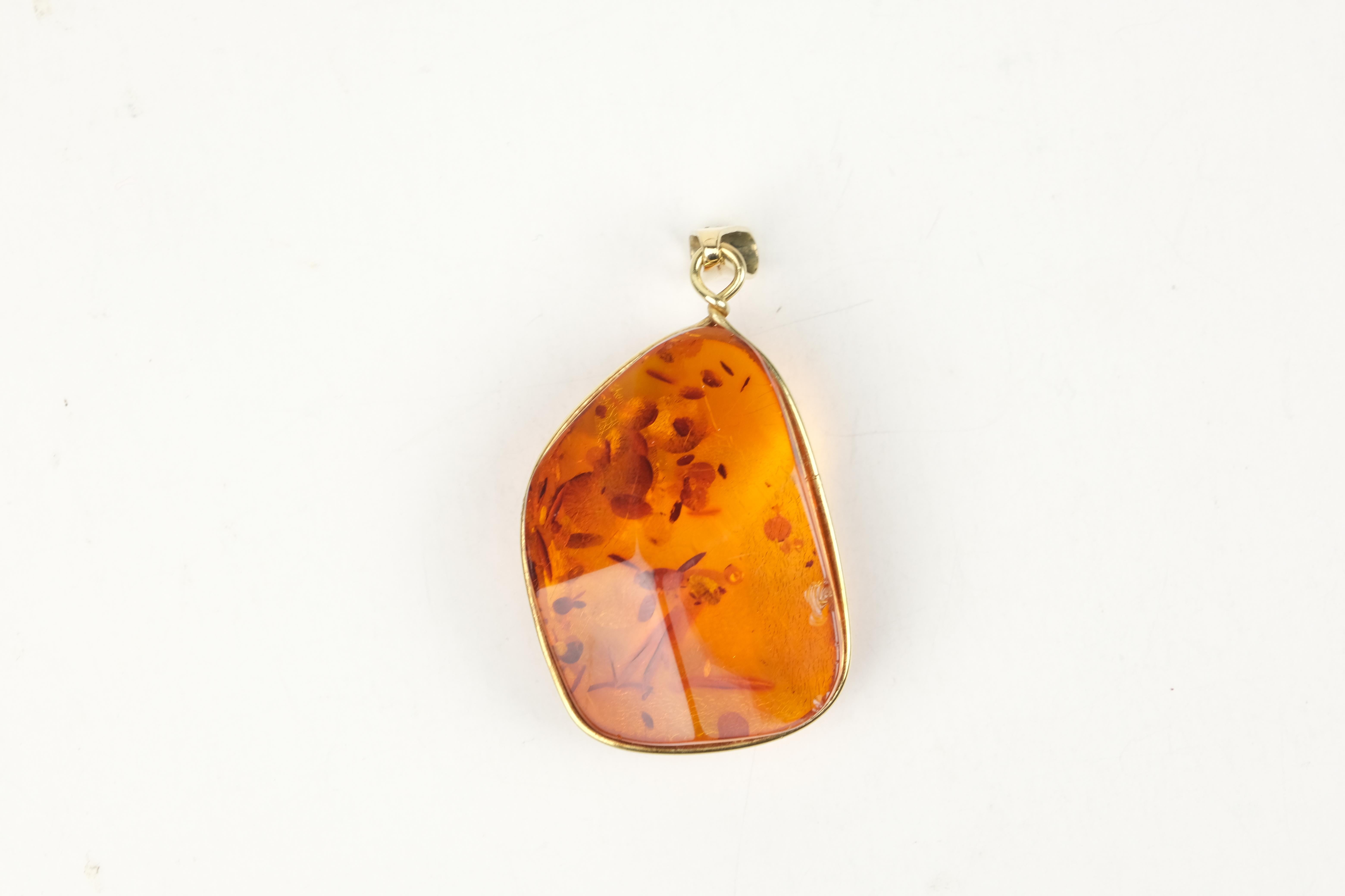 Amber pendant to be attached to your necklace.