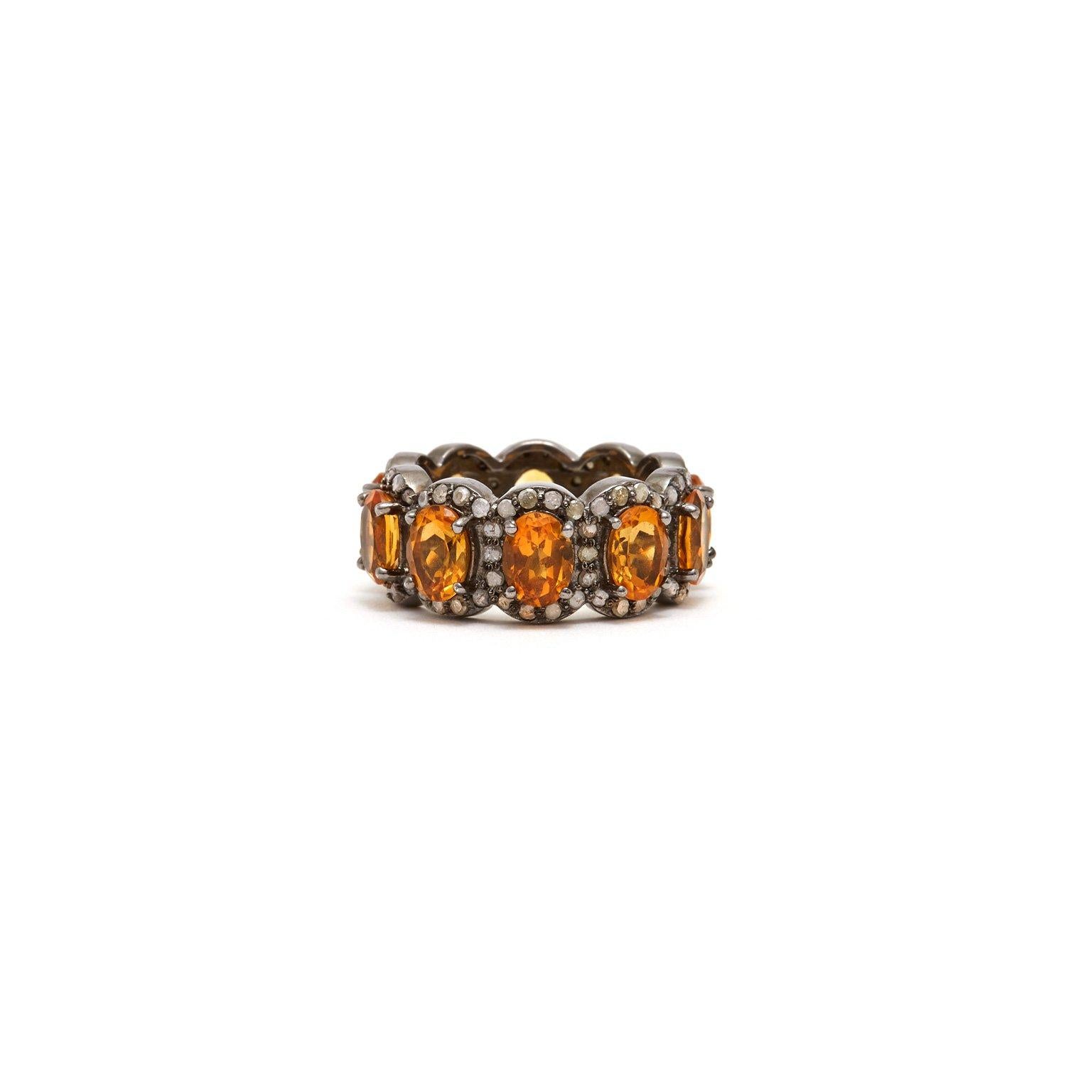 Baguettes of fiery amber orange Citrine accented with Diamonds in a blackened silver band reminiscent of an Art Deco Tiara.

- Natural Amber Orange Citrine.
- White Diamonds.
- Set in Blackened Oxidized Silver.
- Size 8.