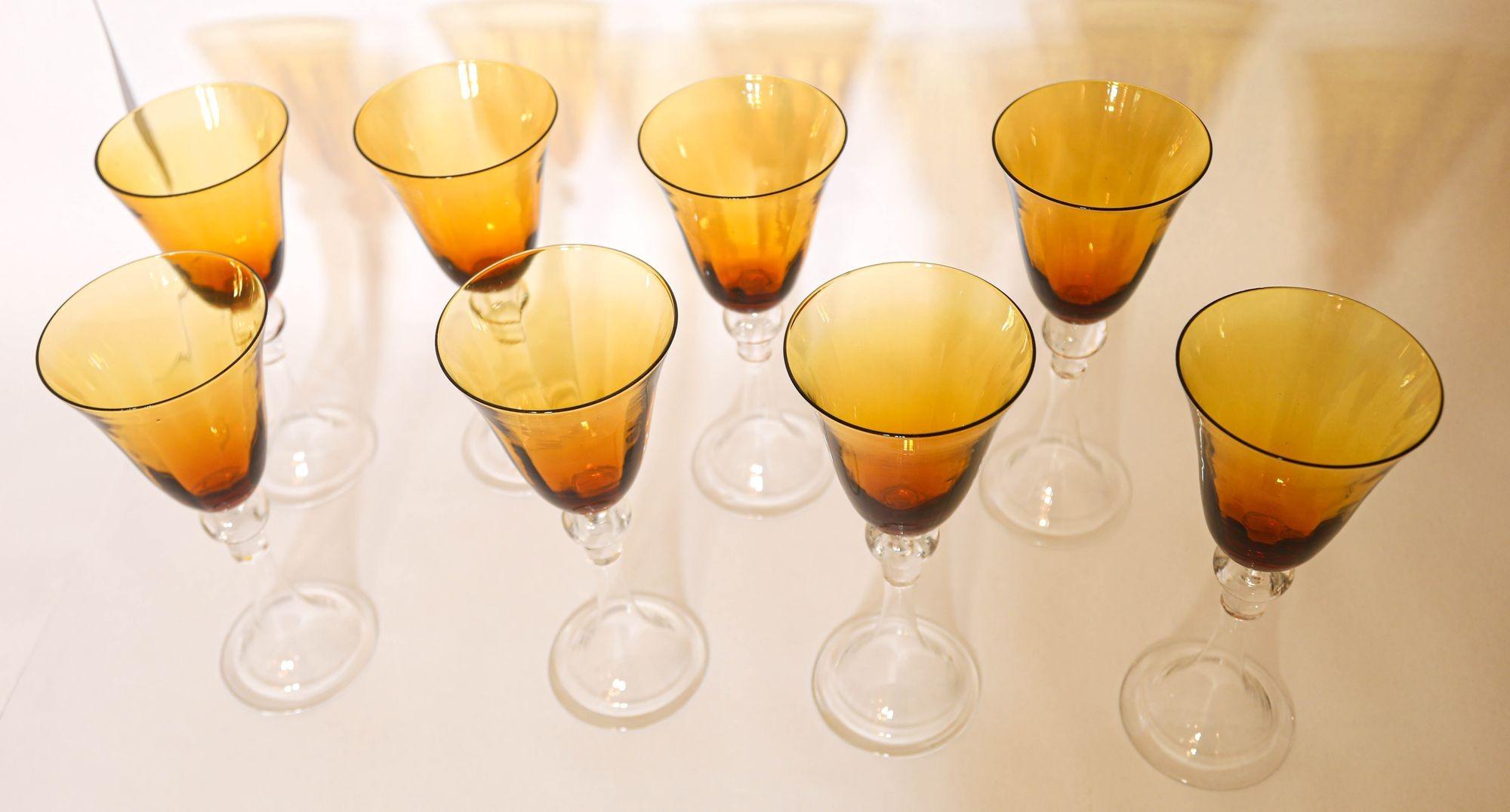 Bohemia Crystal Water Goblet Amber Colored Crystal Wine Stemware. Beautiful set of eight vintage blown glass goblets fluted amber to clear crystal stem wine or water glasses.This wonderful set of 8 glasses features a bright amber color cup with a