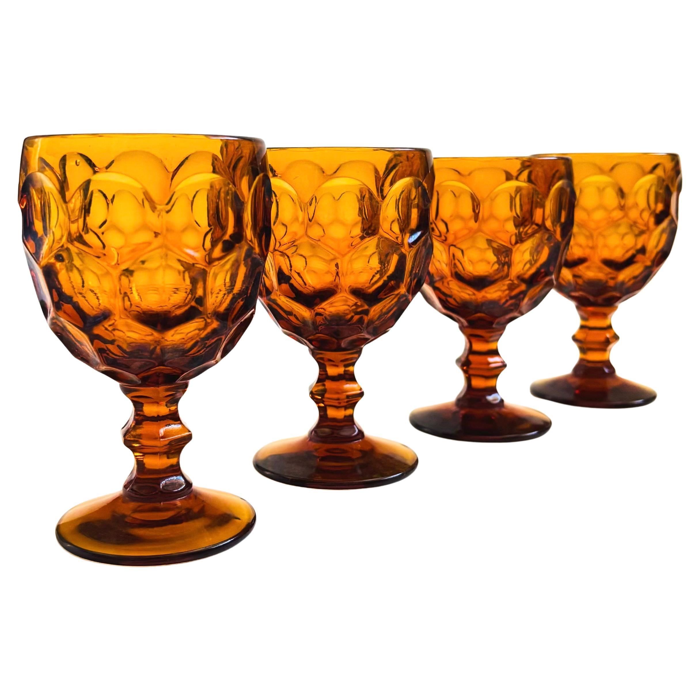A set of 4 gorgeous wine goblets in amber glass. Made in the 