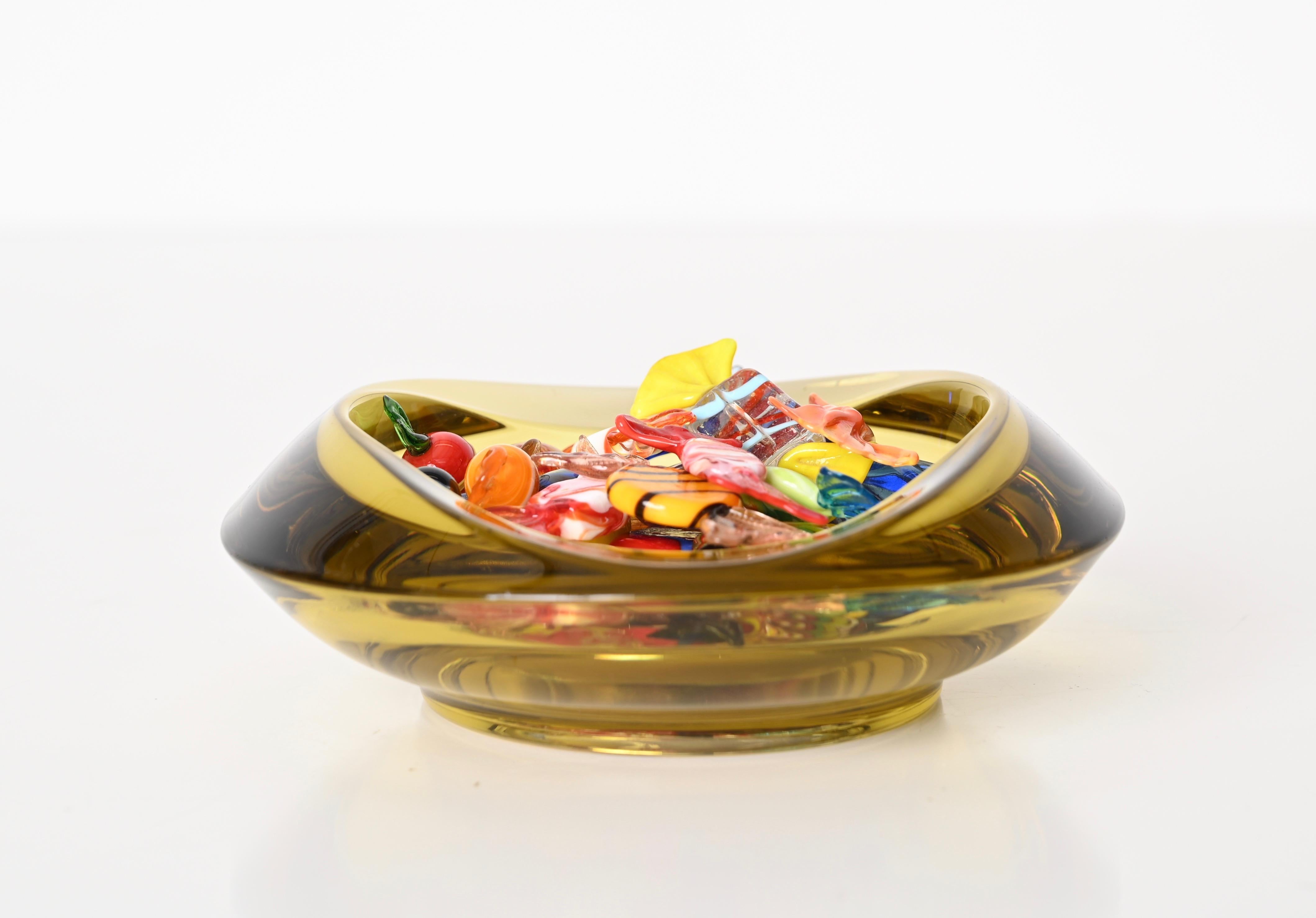 Beautiful bowl or ashtray made in a spectacular ambered yellow Murano glass using the 
