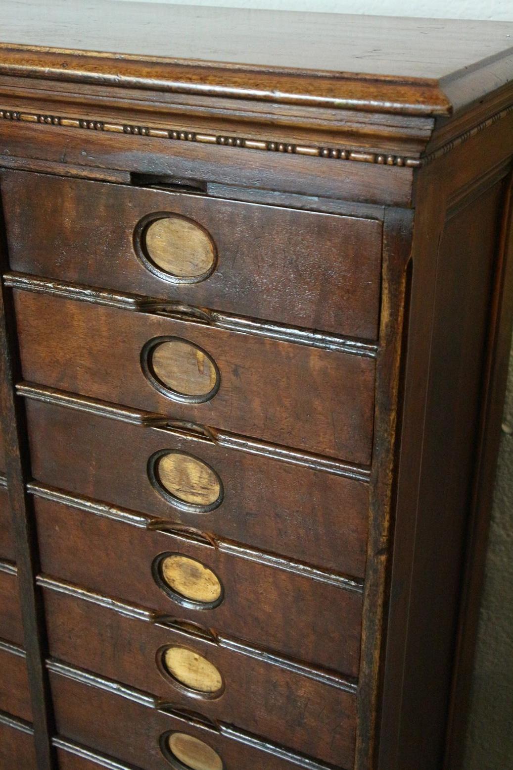 Aged antique walnut filing cabinet from the Amberg company. A total of 36 drawers. In good and original condition. Practical cabinet for multiple purposes.
Origin: US
Period: circa 1900
Size: br. 146cm x 32cm x H 111cm.